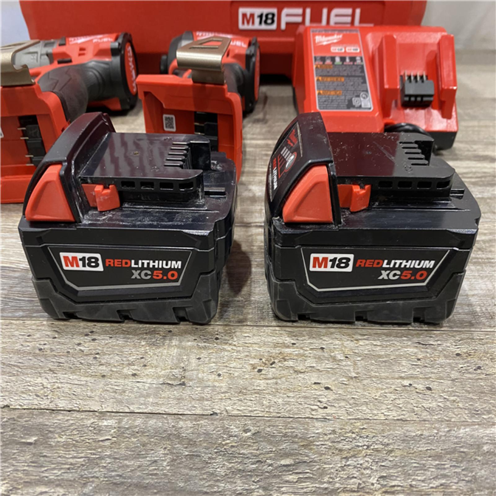 AS-IS Milwaukee FUEL 18V Lithium-Ion Brushless Cordless Hammer Drill and Impact Driver Combo Kit