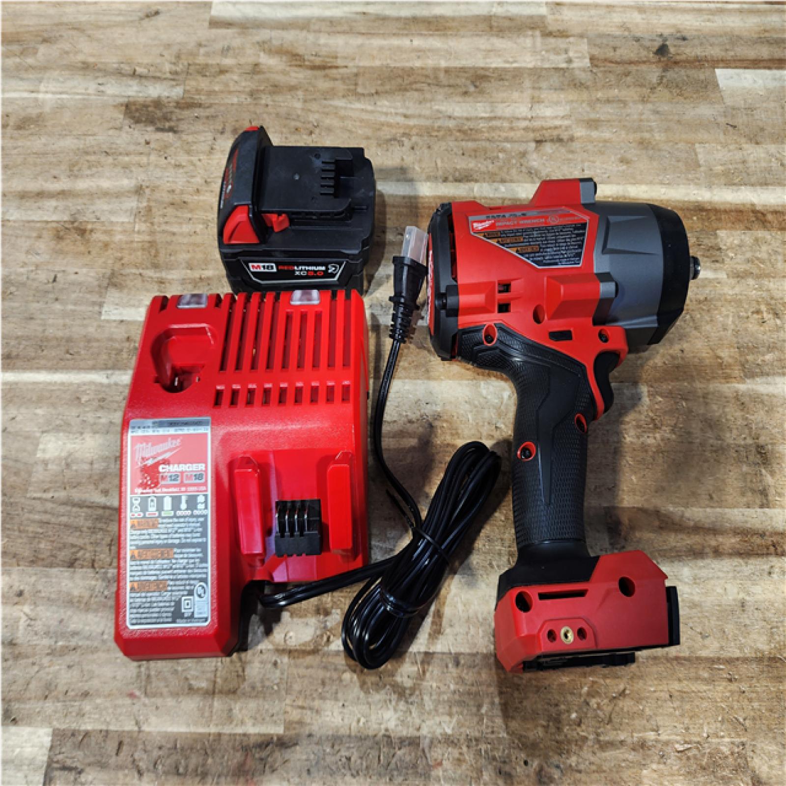 Houston Location AS-IS Milwaukee FUEL Impact and Battery with Charger