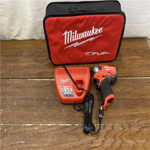 AS-IS M12 FUEL SURGE 12V Lithium-Ion Brushless Cordless 1/4 in. Hex Impact Driver Compact Kit W/Two 2.0Ah Batteries, Bag