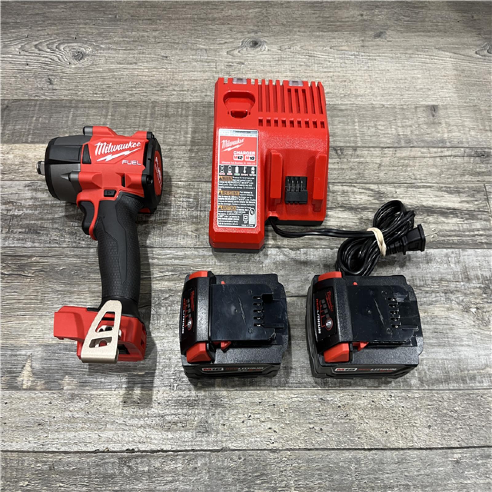 AS-IS Milwaukee FUEL 18V Lithium-Ion Brushless Cordless 1/2 in. Mid-Torque Impact Wrench with Friction Ring Kit