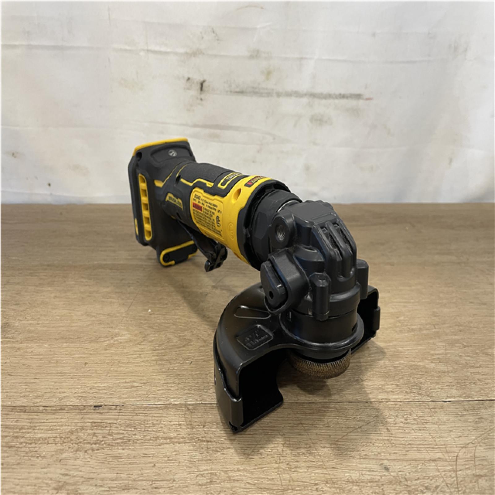 AS-IS DEWALT ATOMIC 20V MAX Cordless 4-1/2 in. Angle Grinder with Paddle Switch (Tool Only)