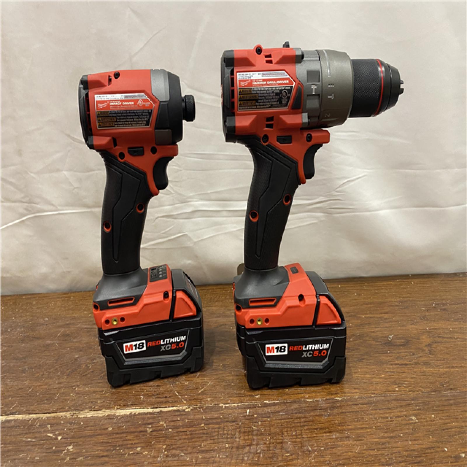 AS-IS MILWAUKEE M18 FUEL 18V Lithium-Ion Brushless Cordless Hammer Drill and Impact Driver Combo Kit (2-Tool) with 2 Batteries