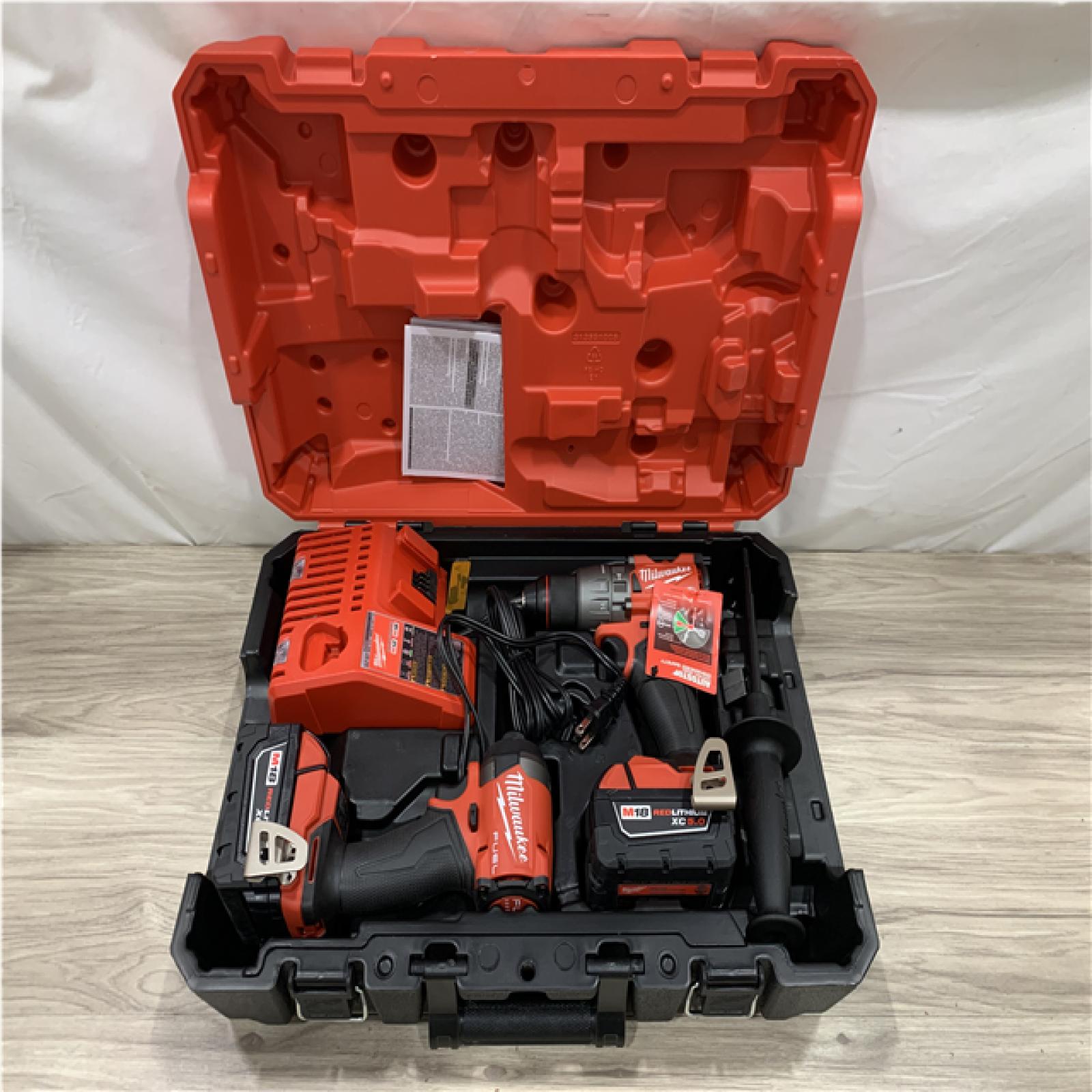 AS-IS Milwaukee FUEL 18V Lithium-Ion Brushless Cordless Hammer Drill and Impact Driver Combo Kit