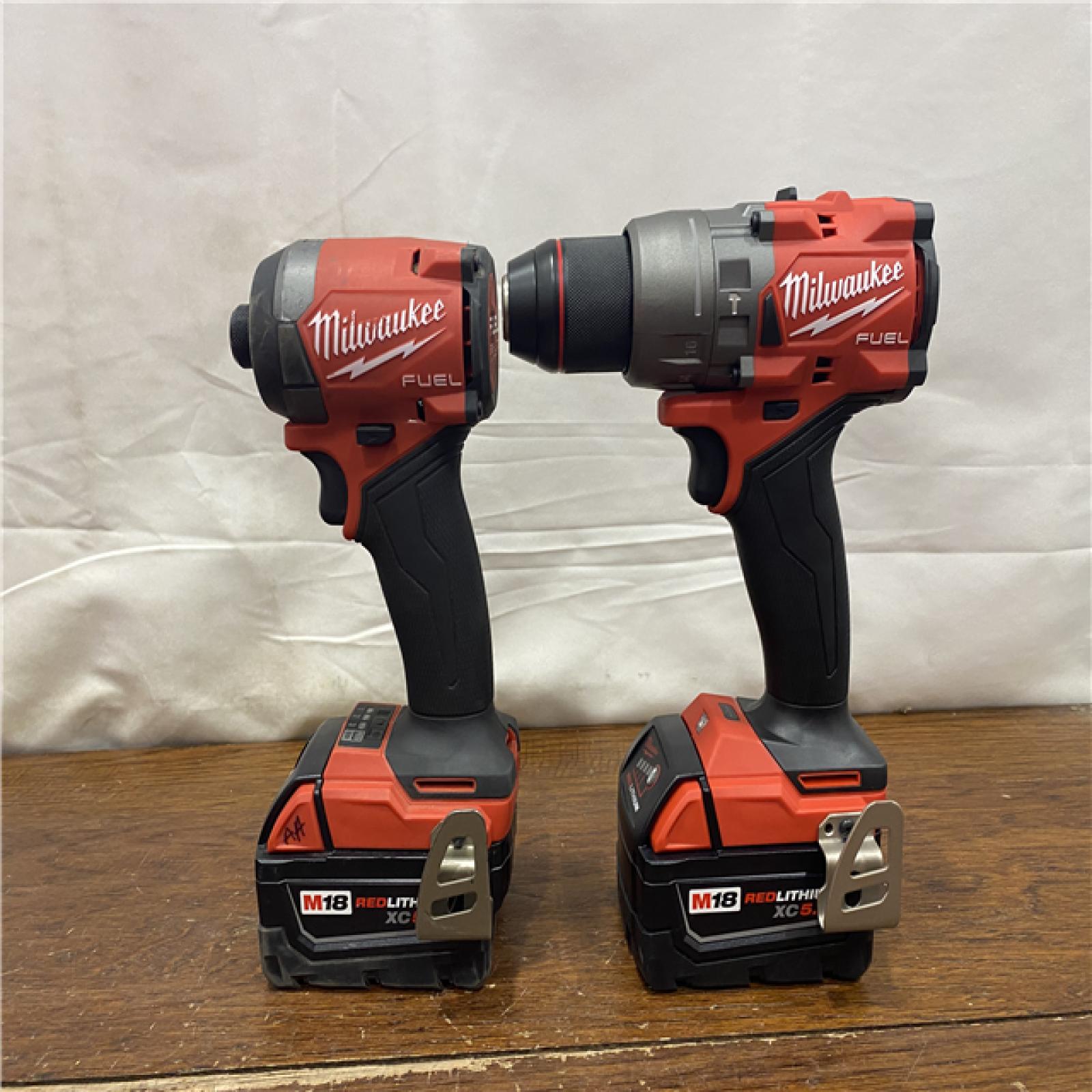 AS-IS MILWAUKEE M18 FUEL 18V Lithium-Ion Brushless Cordless Hammer Drill and Impact Driver Combo Kit (2-Tool) with 2 Batteries