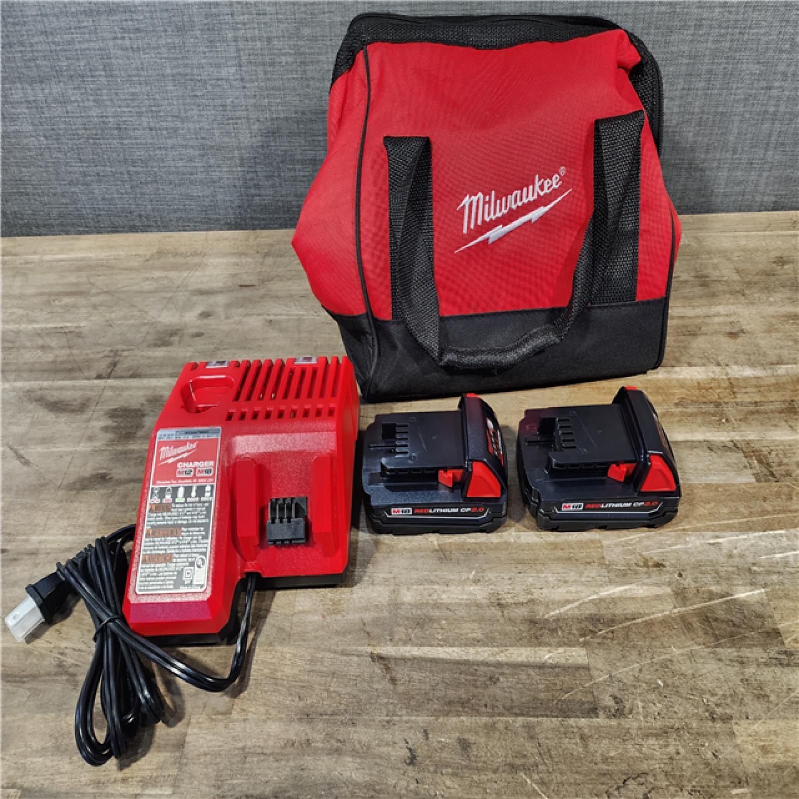 HOUSTON LOCATION - AS-IS Milwaukee M18 18V Lithium-Ion Brushless Cordless Compact Drill/Impact Combo Kit (2-Tool) W/(2) 2.0 Ah Batteries  Charger & Bag