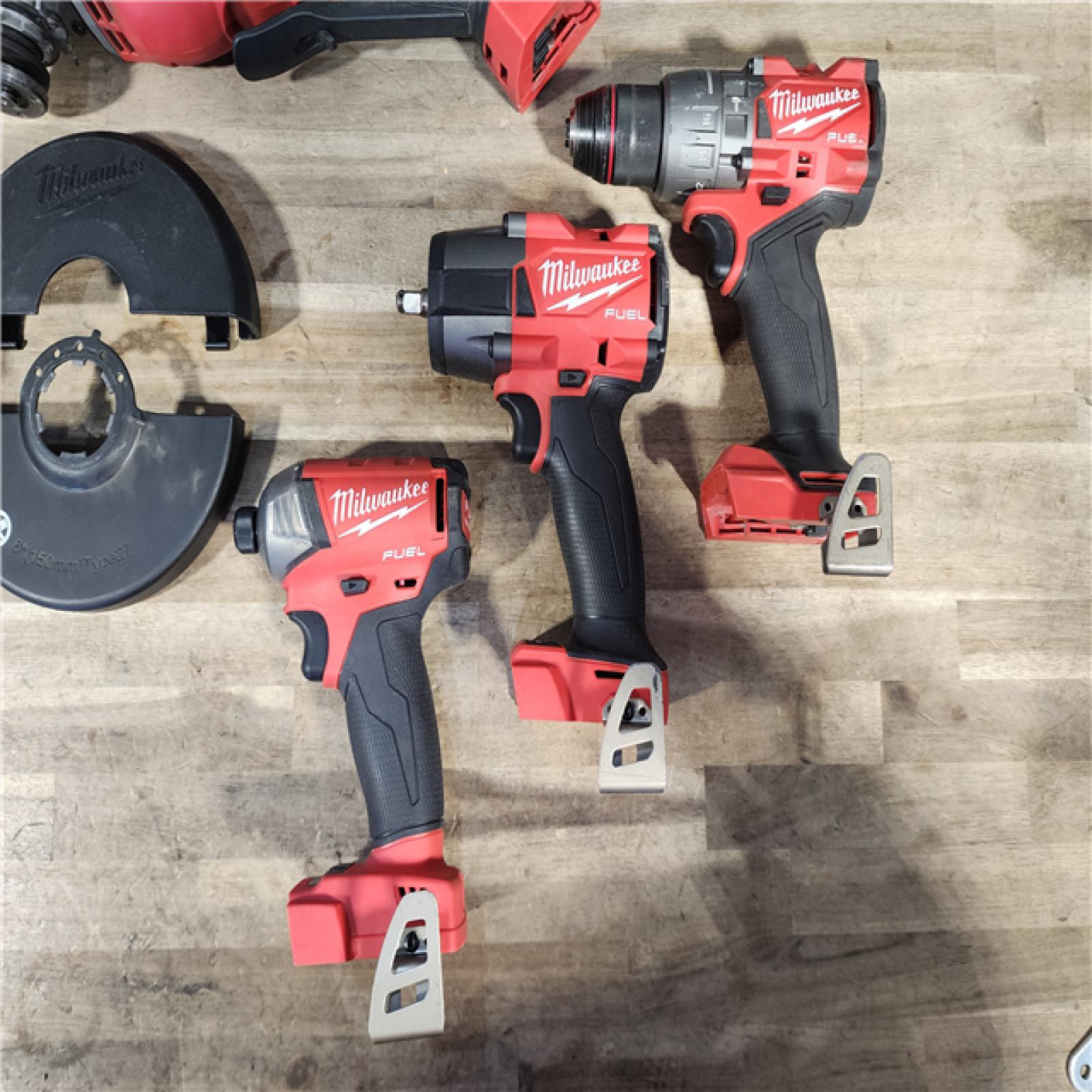 HOUSTON LOCATION - AS-IS MILWAUKEE 4 TOOL COMBO KIT W/ (2) BATTERY & CHARGER