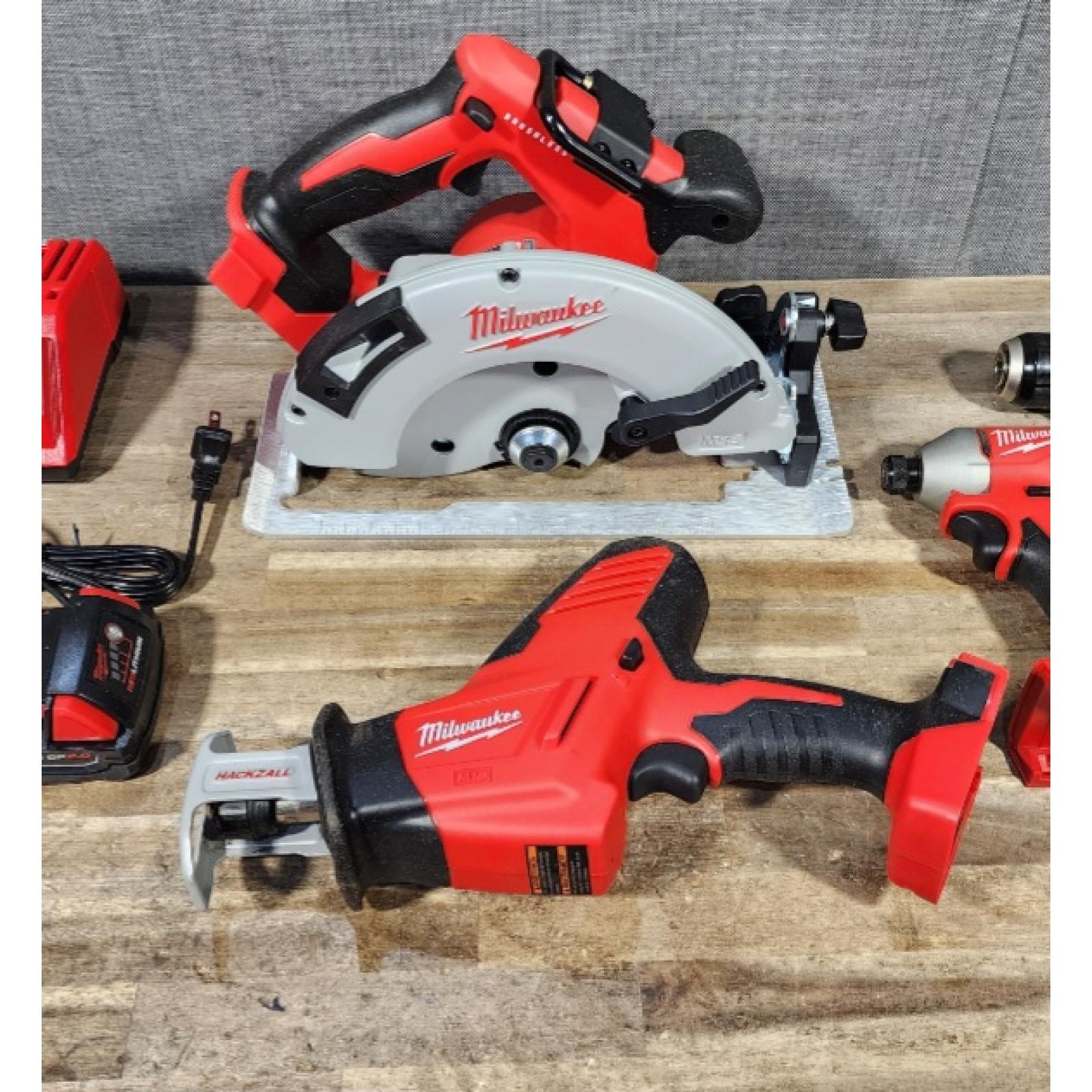 HOUSTON LOCATION - AS-IS Milwaukee M18 18-Volt Lithium-Ion Brushless Cordless Combo Kit (4-Tool) with 2-Batteries  1-Charger and Tool Bag