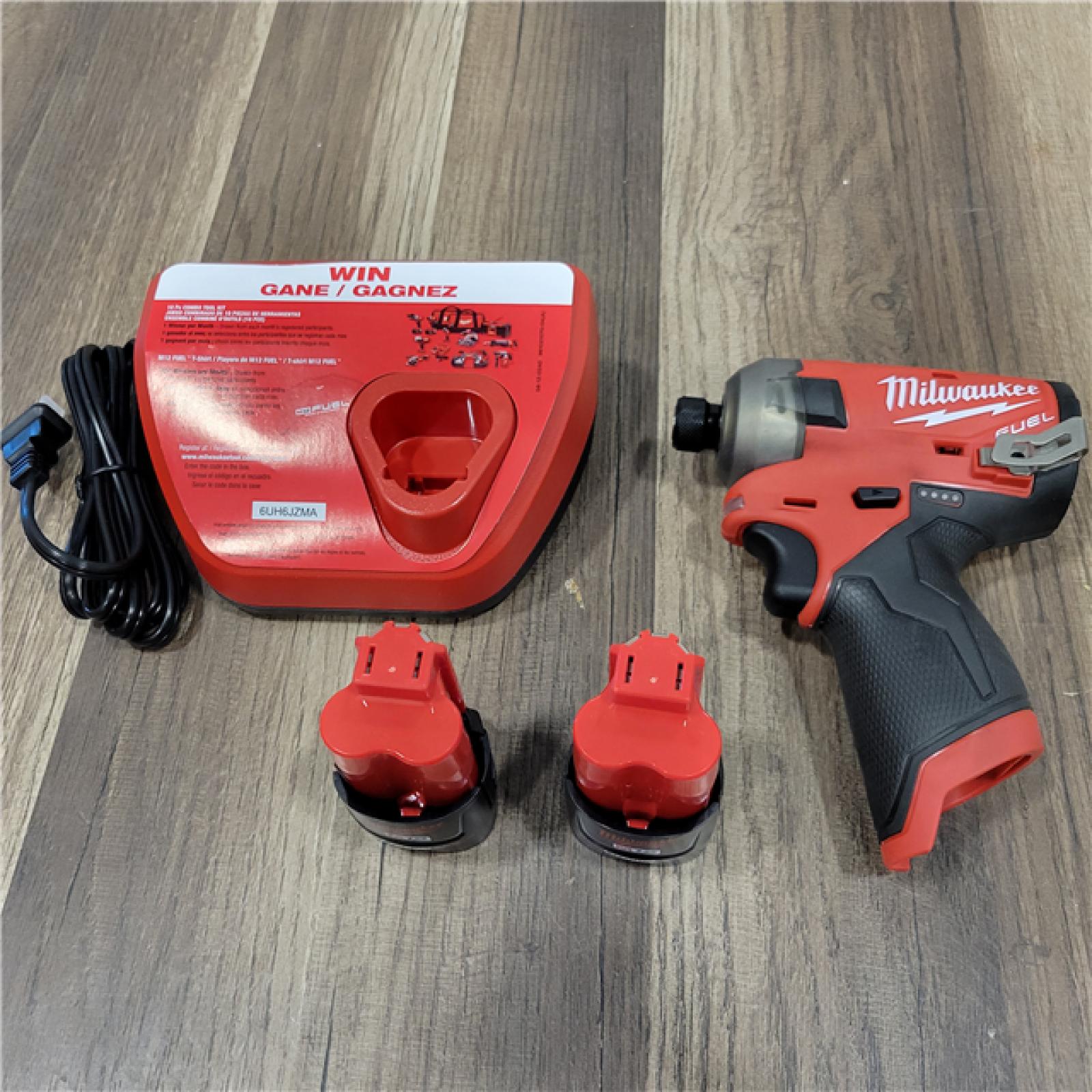 AS-IS Milwaukee M12 FUEL SURGE 12V Lithium-Ion Brushless Cordless 1/4 in. Hex Impact Driver Compact Kit W/Two 2.0Ah Batteries, Bag
