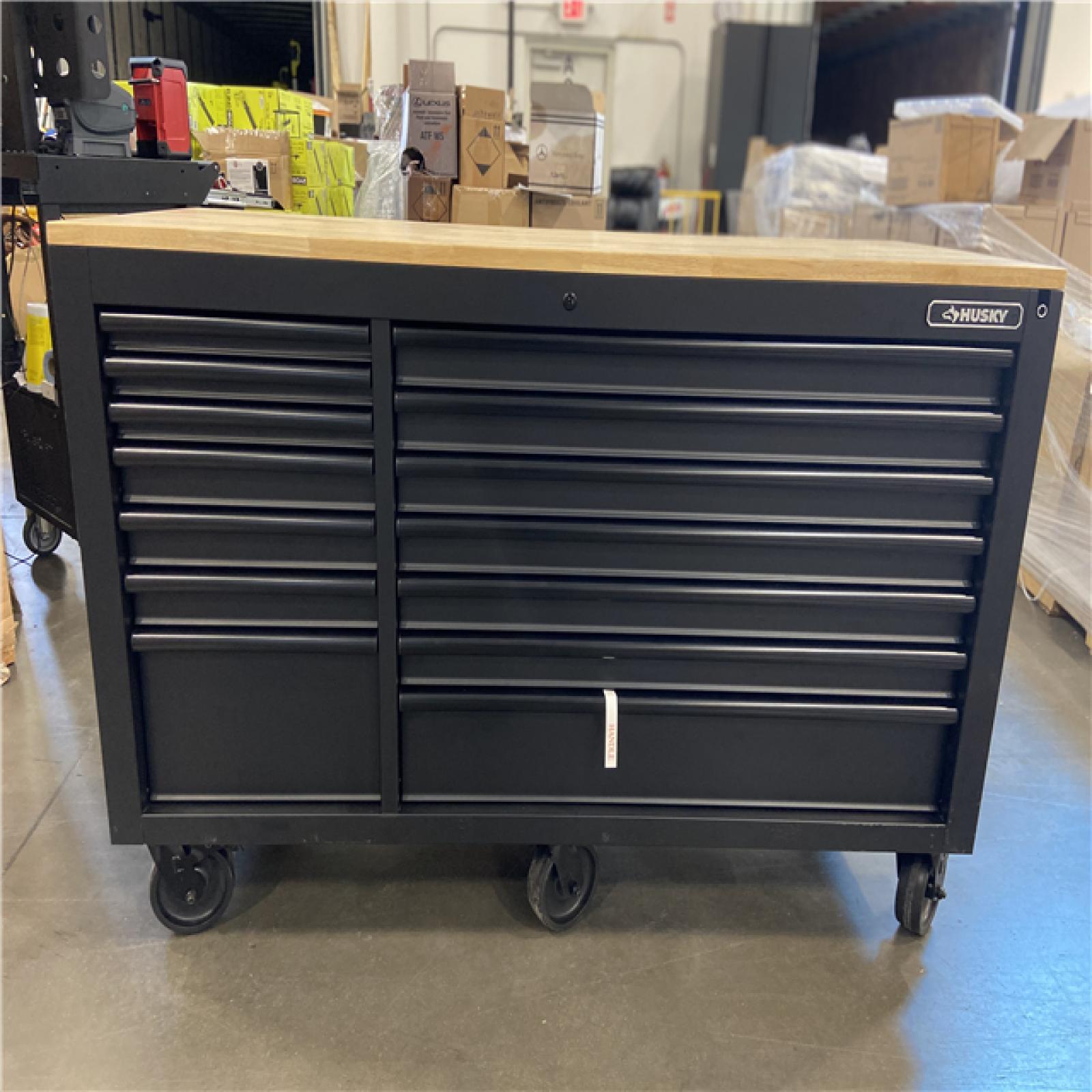 DALLAS LOCATION - Husky 61 in. W x 23 in. D Heavy Duty 15-Drawer Mobile Workbench Tool Chest with Solid Wood Top in Matte Black