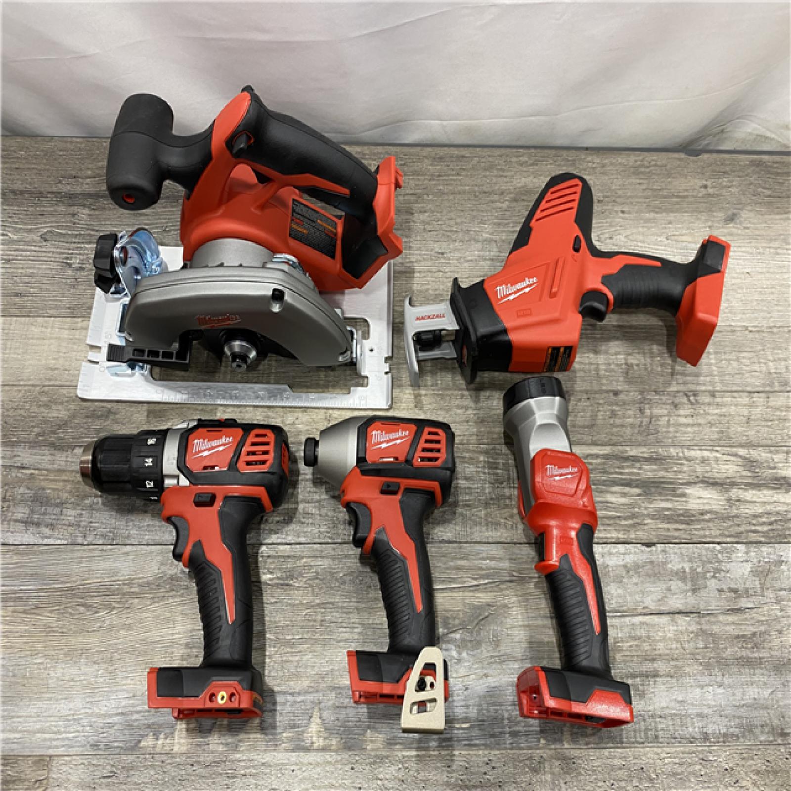 AS-IS Milwaukee 18V Lithium-Ion Cordless Combo Kit (5-Tool) with (1) 3.0Ah and (1) 1.5Ah Battery  (1) Charger  (1) Tool Bag
