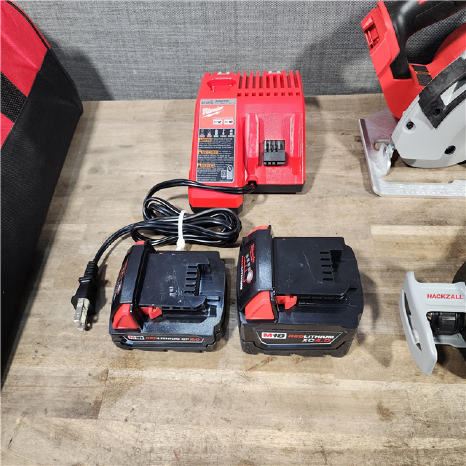 HOUSTON LOCATION - AS-IS Milwaukee M18 18-Volt Lithium-Ion Brushless Cordless Combo Kit (4-Tool) with 2-Batteries  1-Charger and Tool Bag