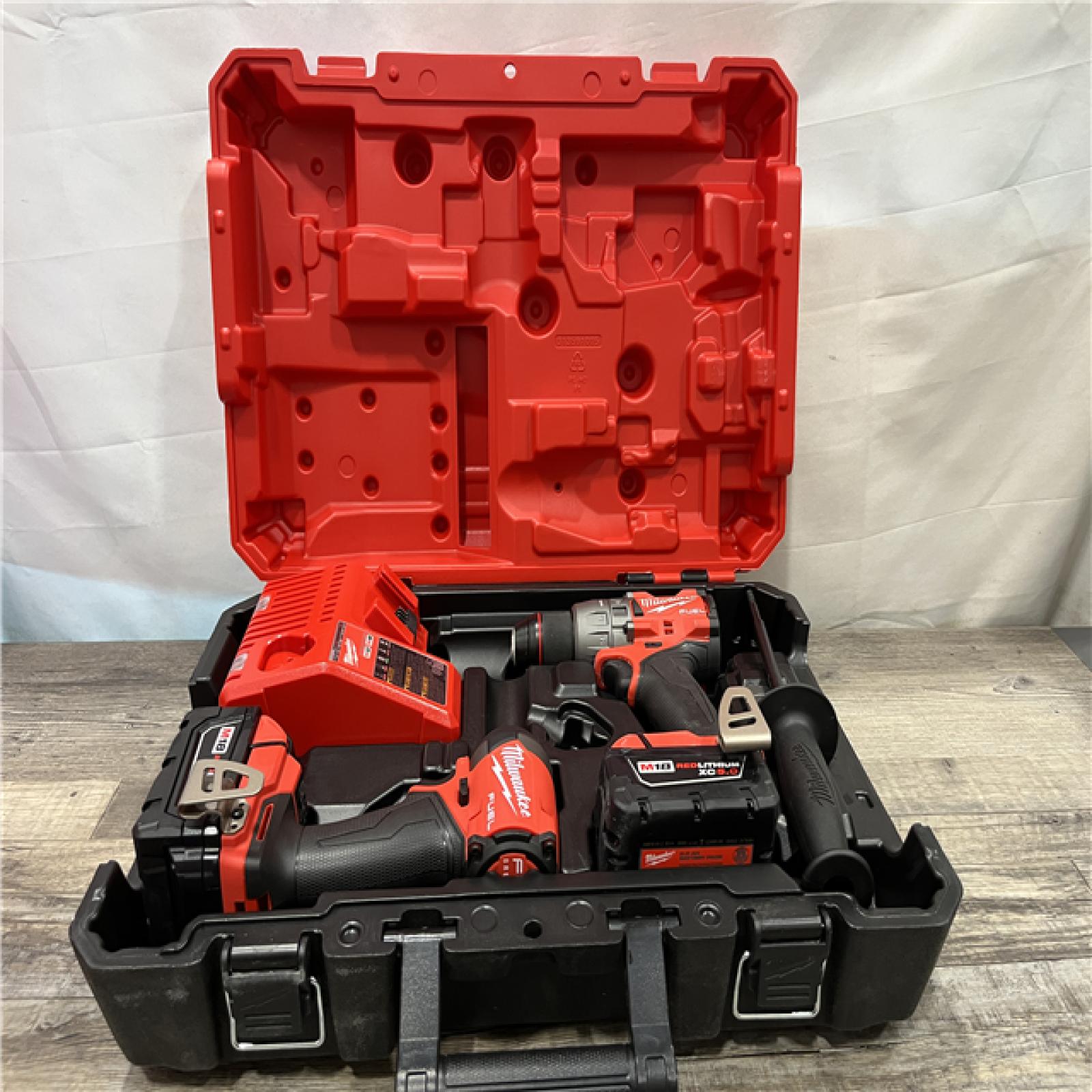 AS-IS Milwaukee FUEL 18V Lithium-Ion Brushless Cordless Hammer Drill and Impact Driver Combo Kit