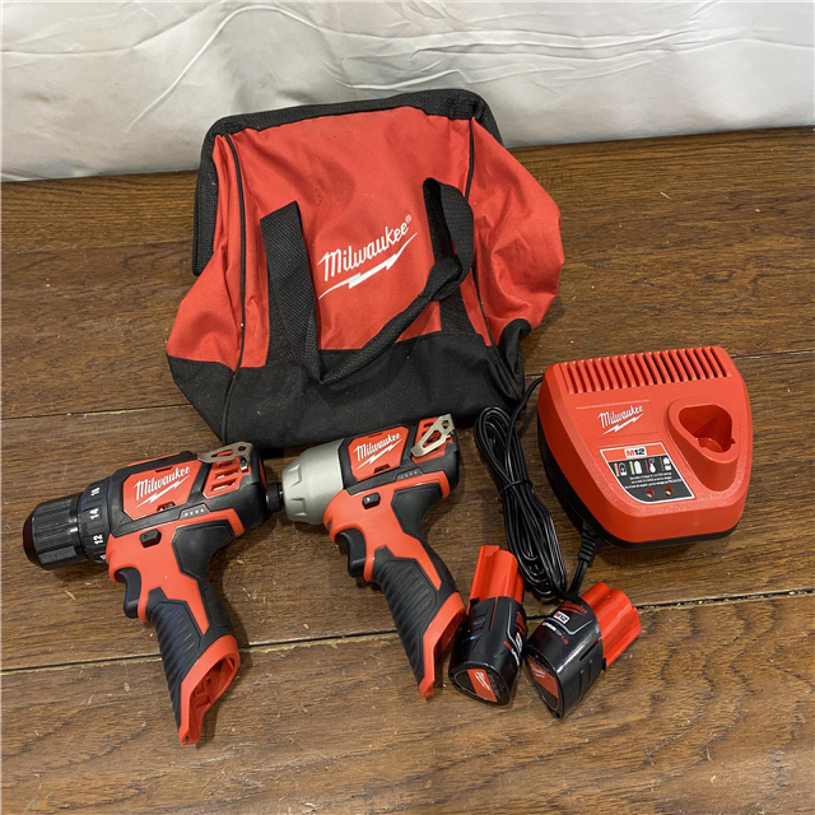 AS-IS Milwaukee 2494-22 M12 Cordless Combination 3/8  Drill / Driver and 1/4  Hex Impact Driver Dual Power Tool Kit (2 Lithium Ion Batteries  Charger  and B