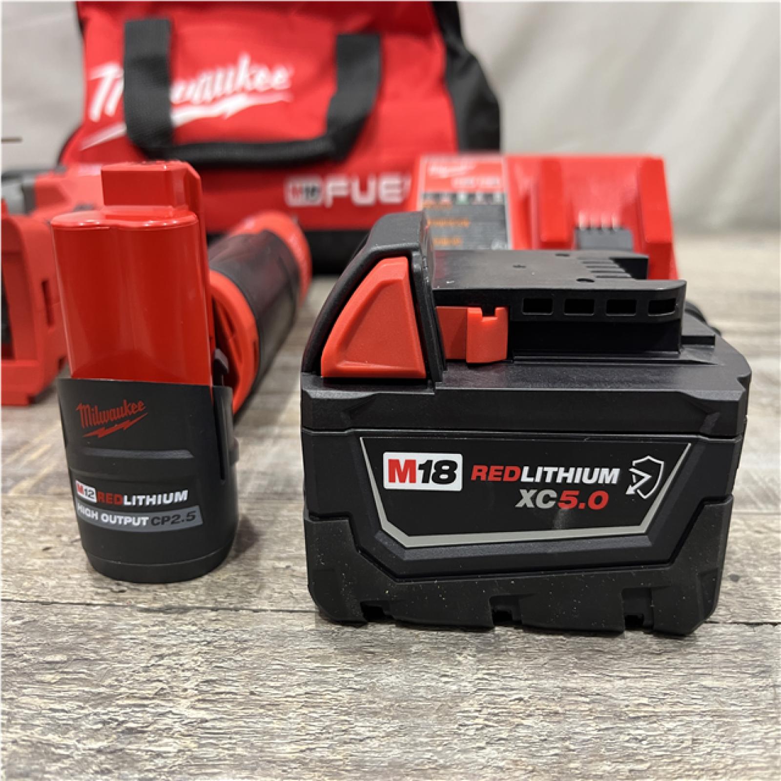 AS-IS Milwaukee FUEL 18V Cordless Mid Torque 1/2 in. Impact Wrench w/ 12 FUEL 3/8 in. Ratchet Combo Kit