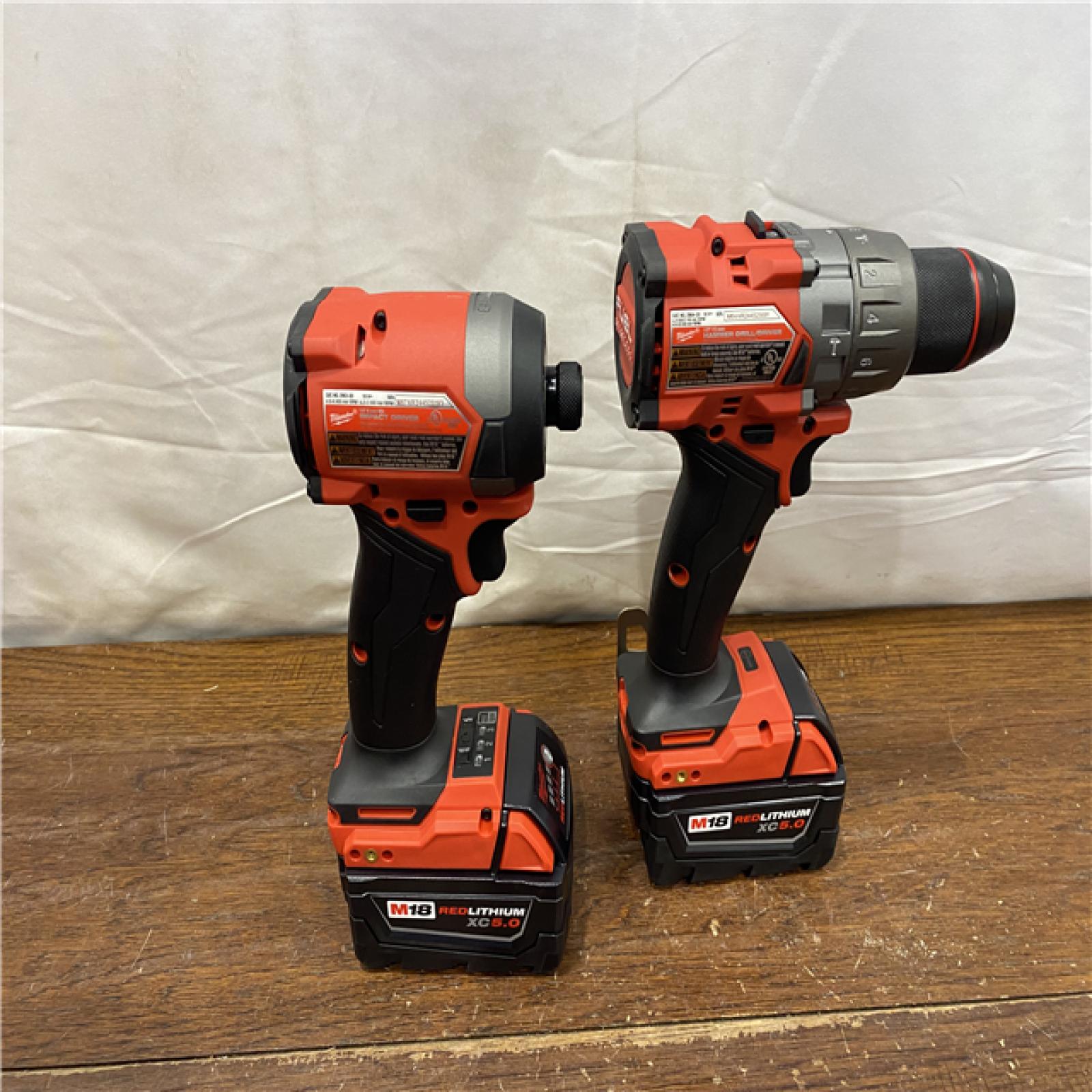 AS-IS MILWAUKEE M18 FUEL 18V Lithium-Ion Brushless Cordless Hammer Drill and Impact Driver Combo Kit (2-Tool) with 2 Batteries