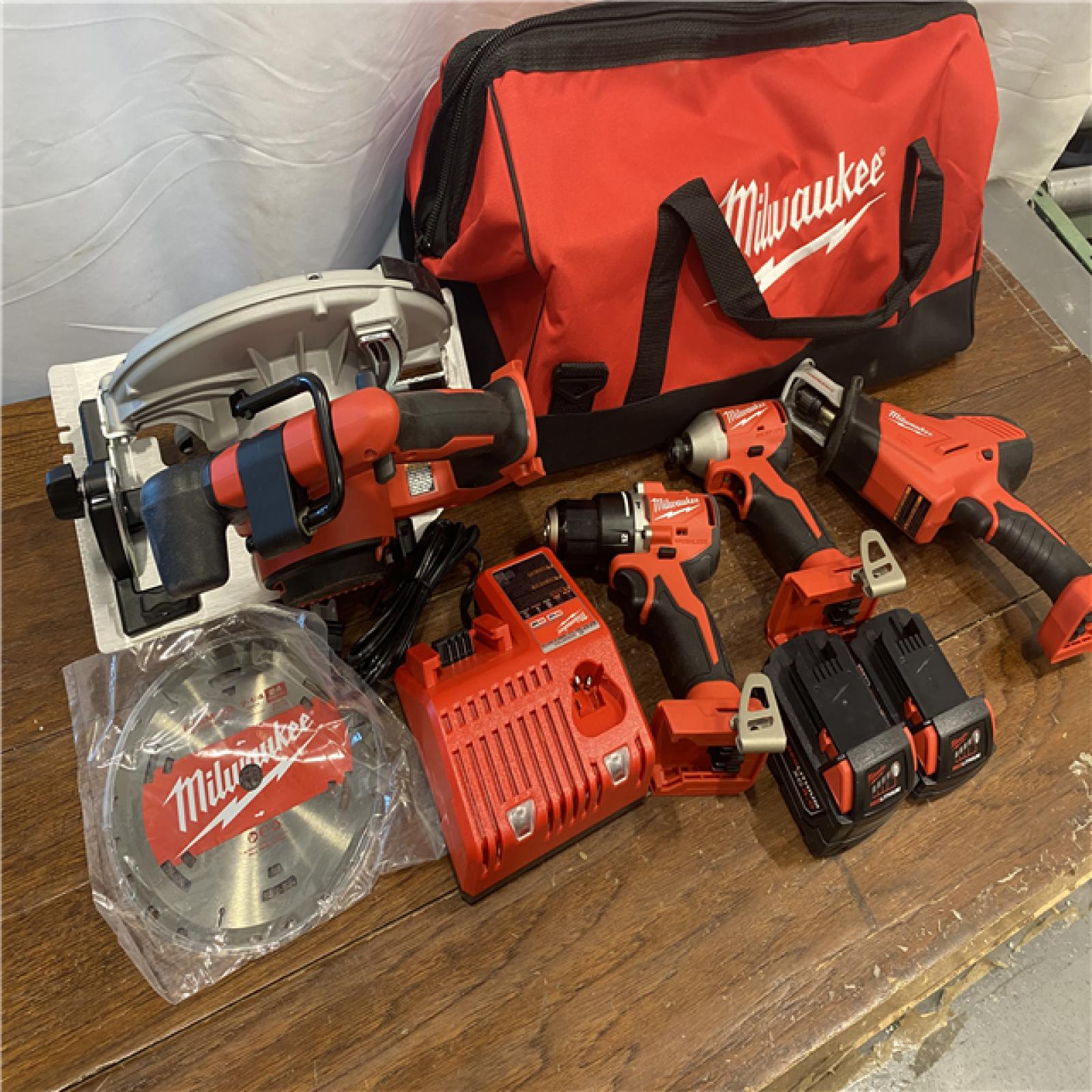 AS-IS Milwaukee M18 18-Volt Lithium-Ion Brushless Cordless Combo Kit (4-Tool) with 2-Batteries, 1-Charger and Tool Bag