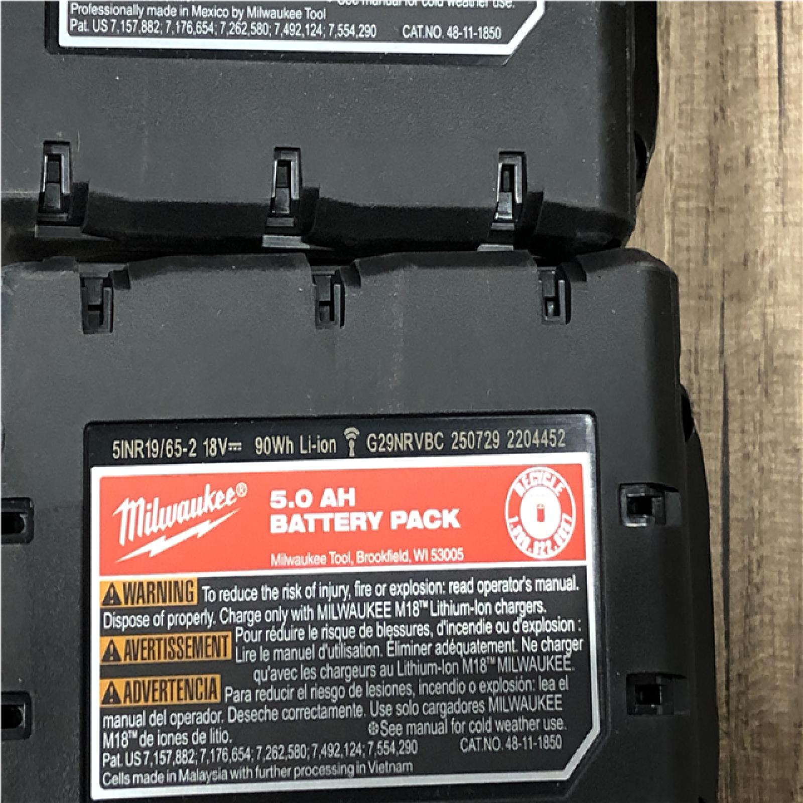 AS-IS Milwaukee 18-Volt Lithium-Ion XC Starter Kit with (2) 5.0Ah Batteries and Charger