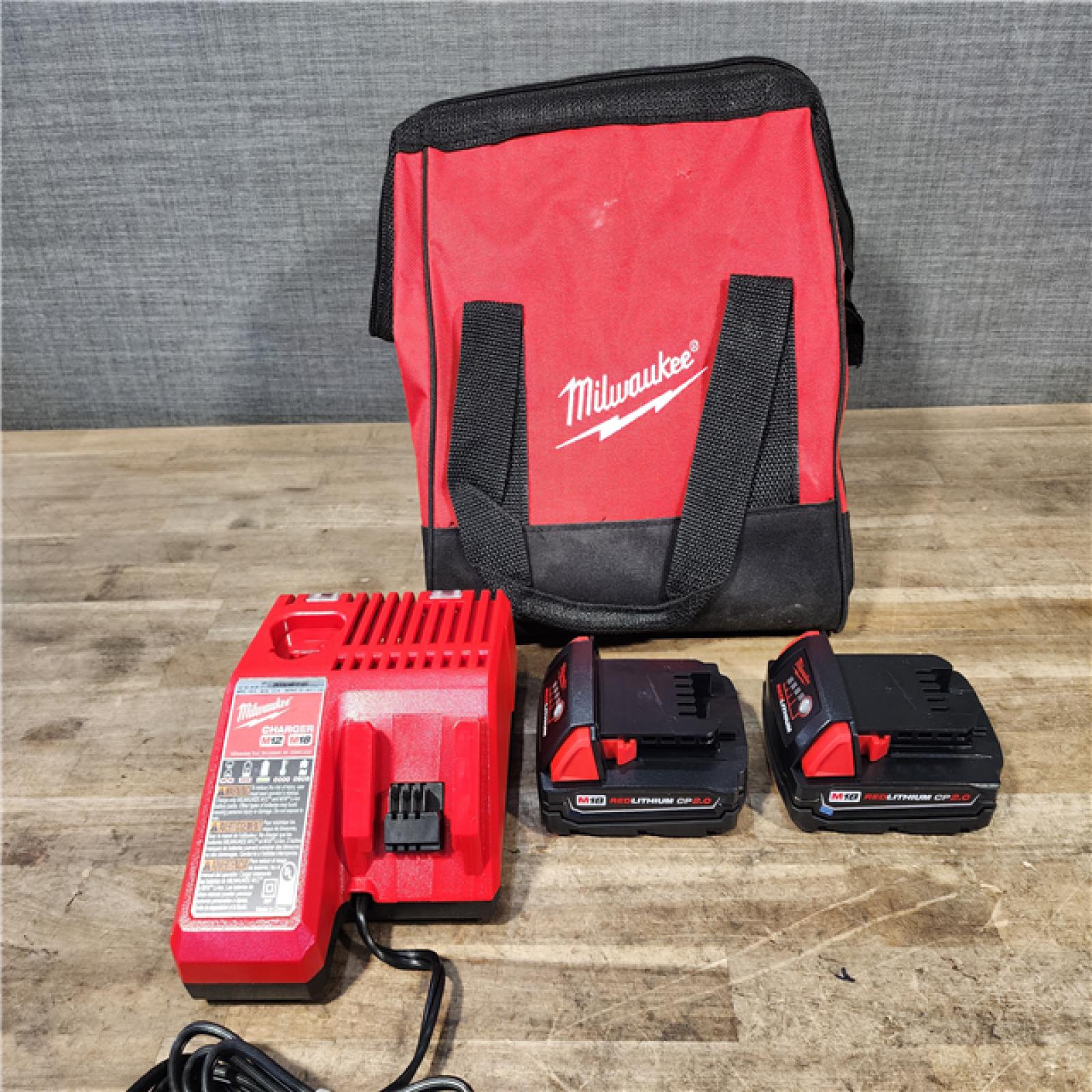 HOUSTON LOCATION - AS-IS Milwaukee M18 18V Lithium-Ion Brushless Cordless Compact Drill/Impact Combo Kit (2-Tool) W/(2) 2.0 Ah Batteries  Charger & Bag