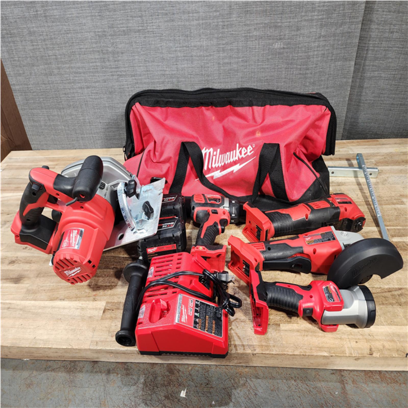 Houston Location AS-IS Milwaukee Drill and Grinder and Multi Tool and Circular Saw and Charger