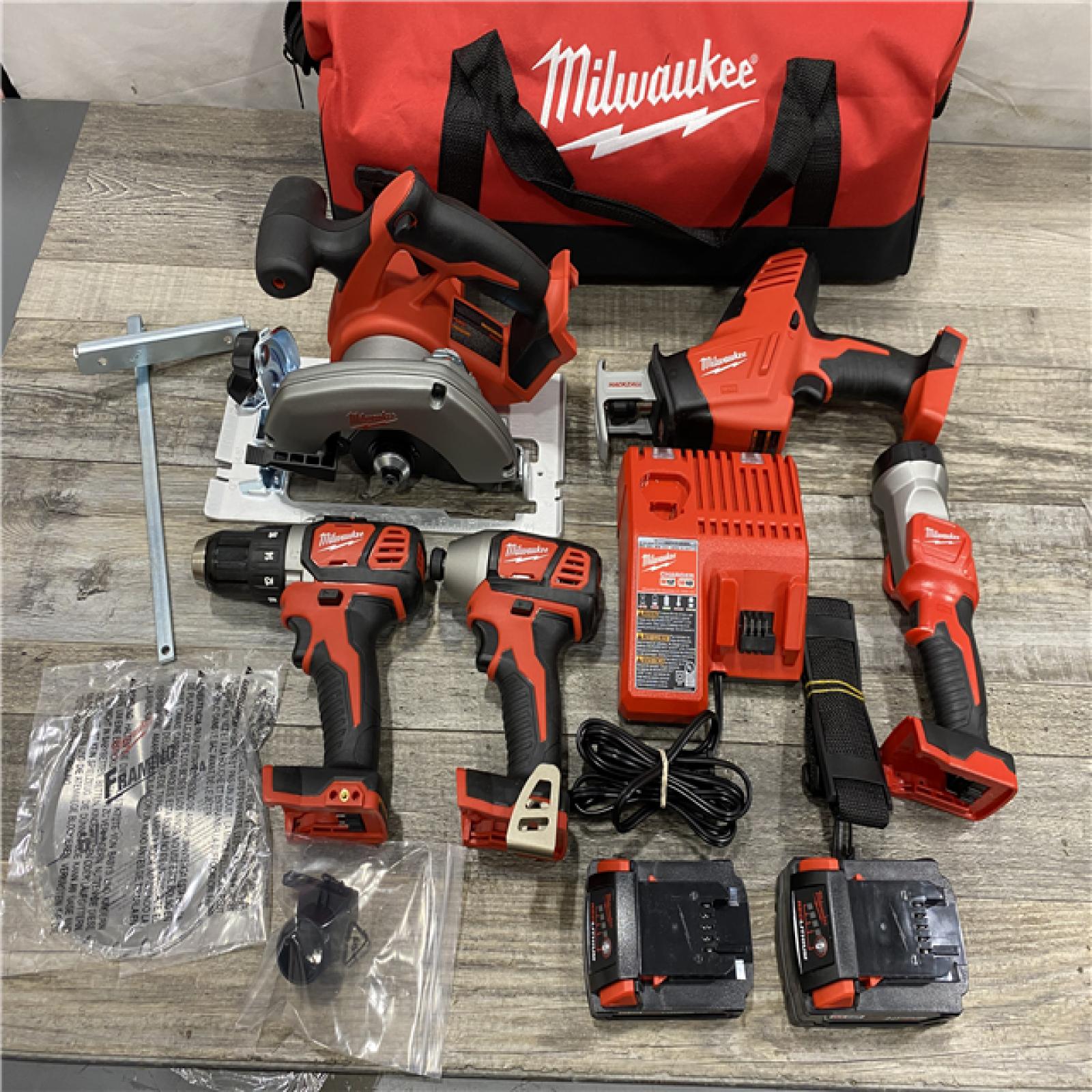 AS-IS Milwaukee 18V Lithium-Ion Cordless Combo Kit (5-Tool) with (1) 3.0Ah and (1) 1.5Ah Battery  (1) Charger  (1) Tool Bag