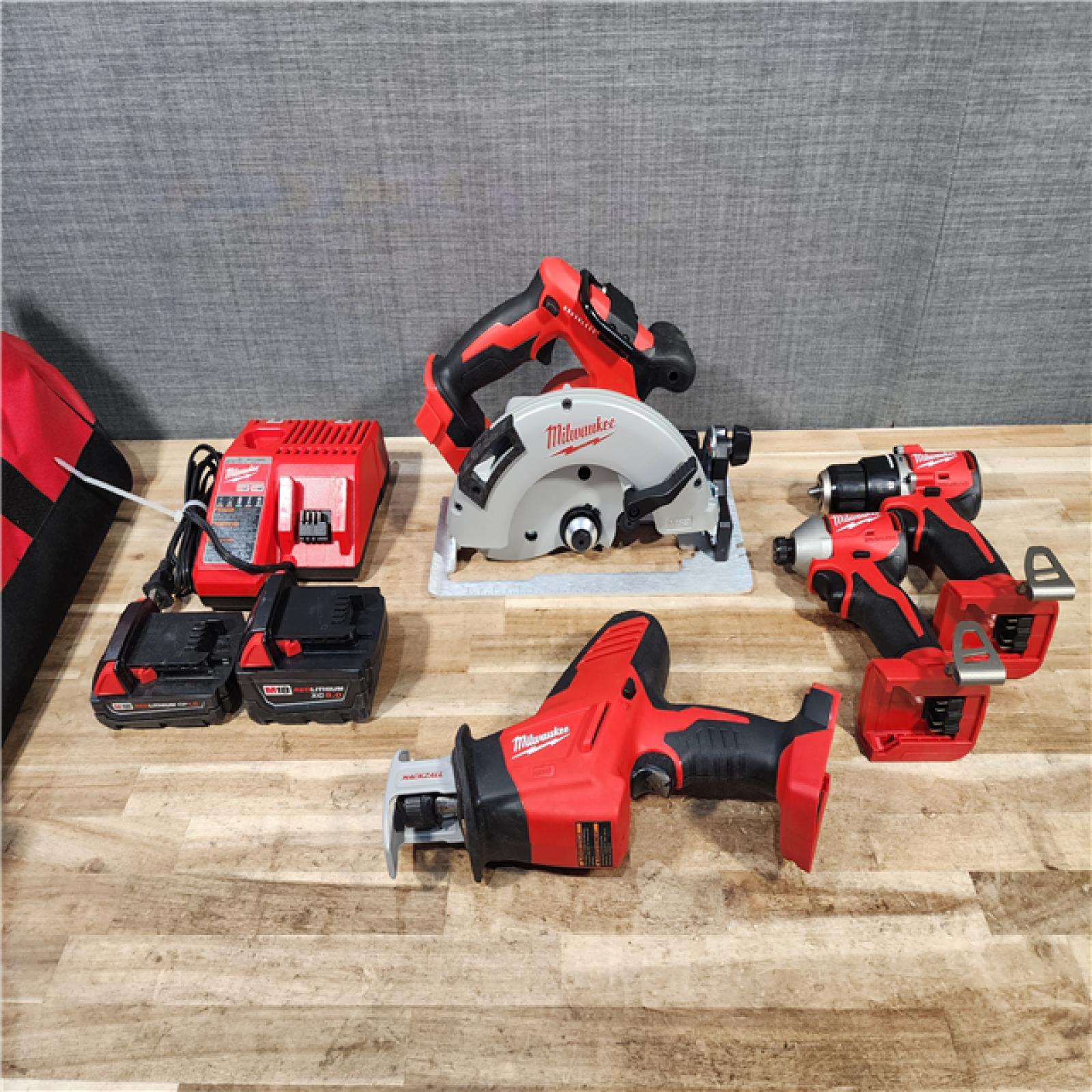 HOUSTON LOCATION - AS-IS MILWAUKEE 4 TOOL COMBO KIT W/ (2) BATTERY & CHARGER