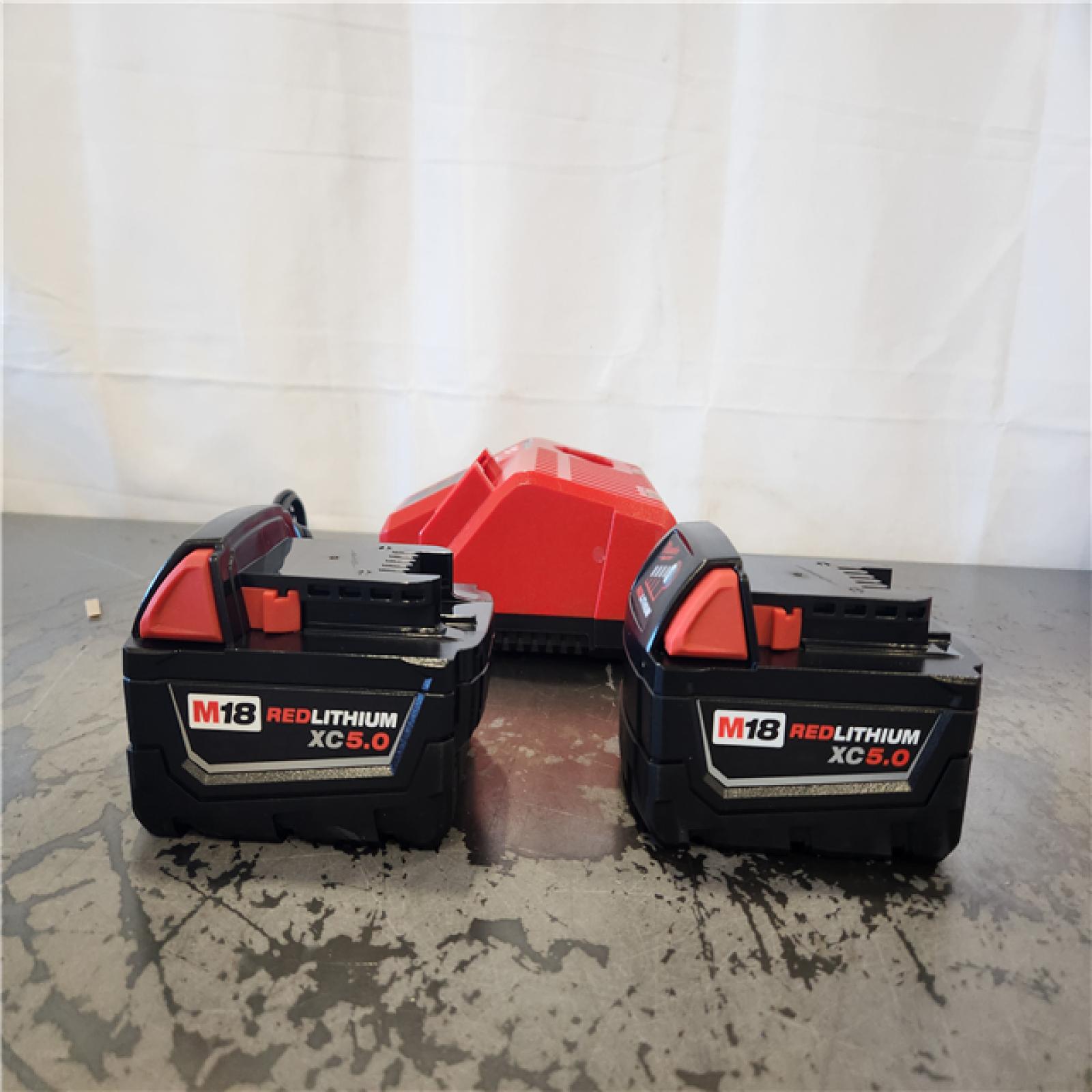 AS-IS- Milwaukee 18-Volt Lithium-Ion XC Starter Kit with Two 5.0Ah Batteries and Charger