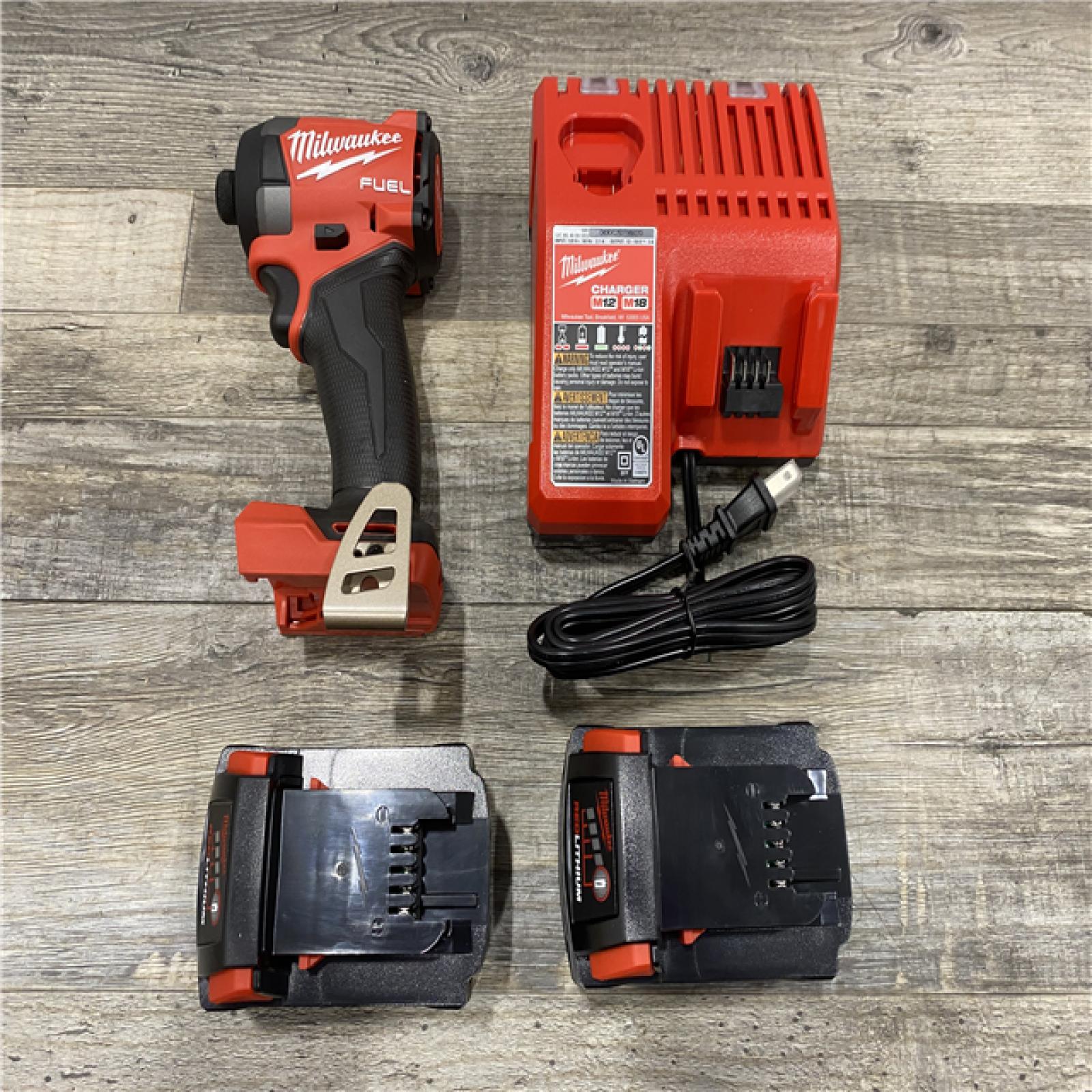 AS-IS Milwaukee FUEL 18V Lithium-Ion Brushless Cordless 1/4 in. Hex Impact Driver Kit