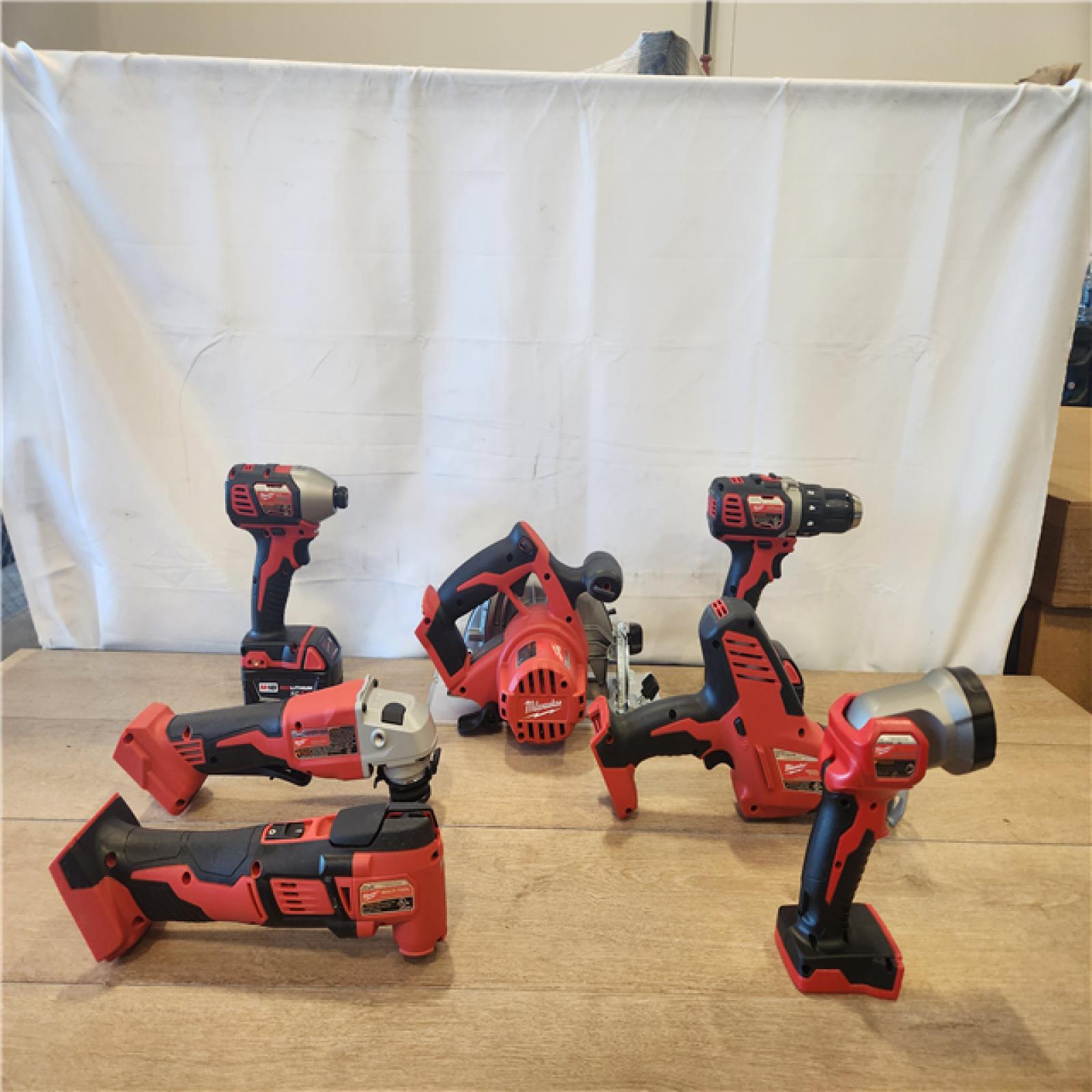 AS-IS- M18 18-Volt Lithium-Ion Cordless Combo Kit 7-Tool with 2-Batteries  Charger and Tool Bag