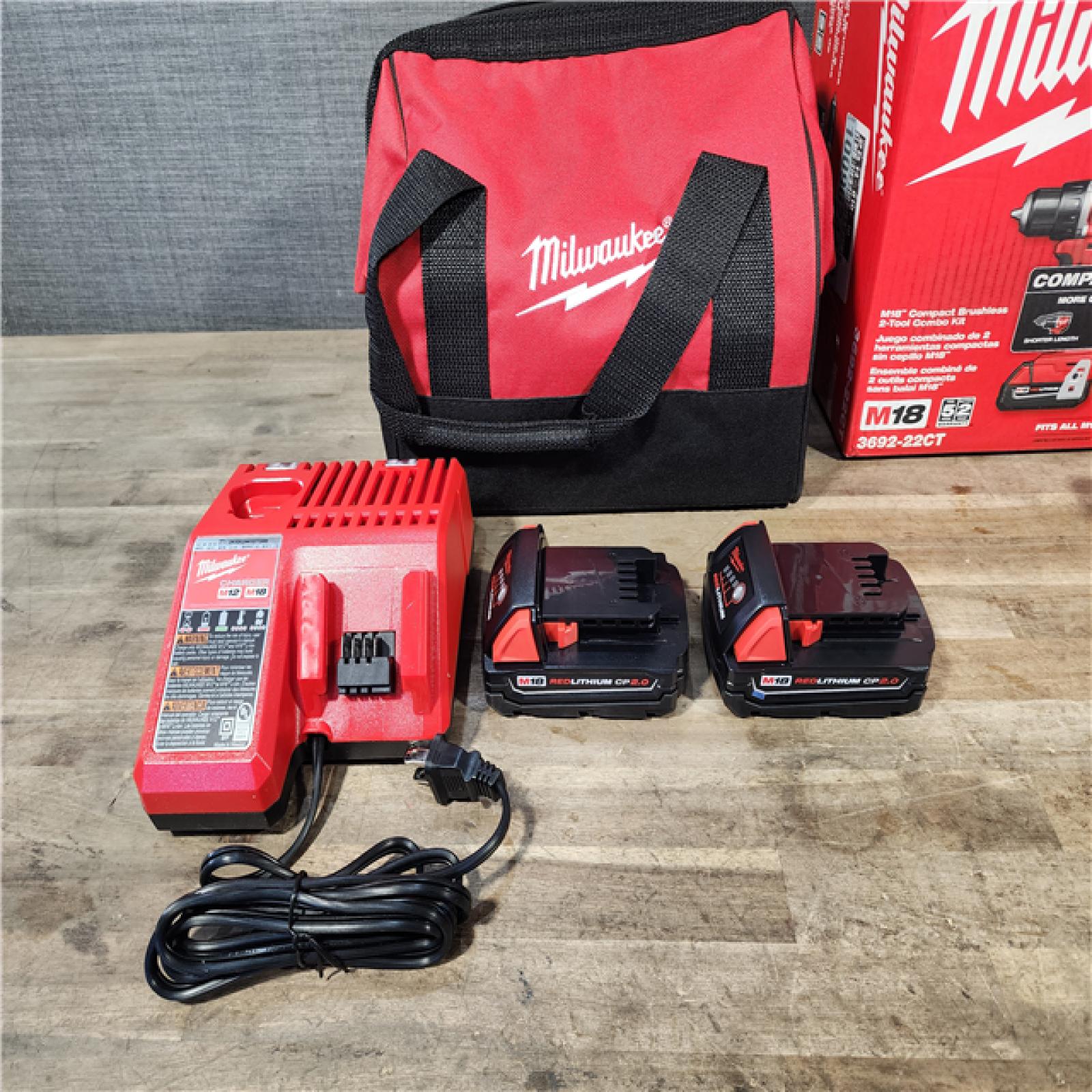 HOUSTON LOCATION - AS-IS Milwaukee M18 18V Lithium-Ion Brushless Cordless Compact Drill/Impact Combo Kit (2-Tool) W/(2) 2.0 Ah Batteries  Charger & Bag