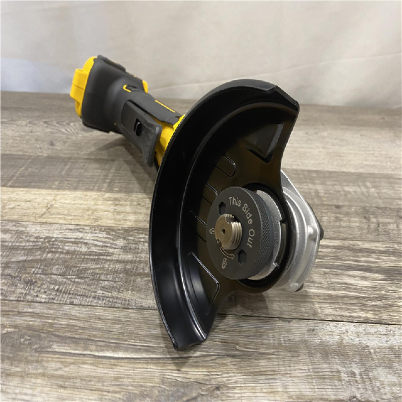 AS-IS DEWALT 20V MAX XR Cordless Brushless 4.5 in. Paddle Switch Small Angle Grinder with Kickback Brake (Tool Only)