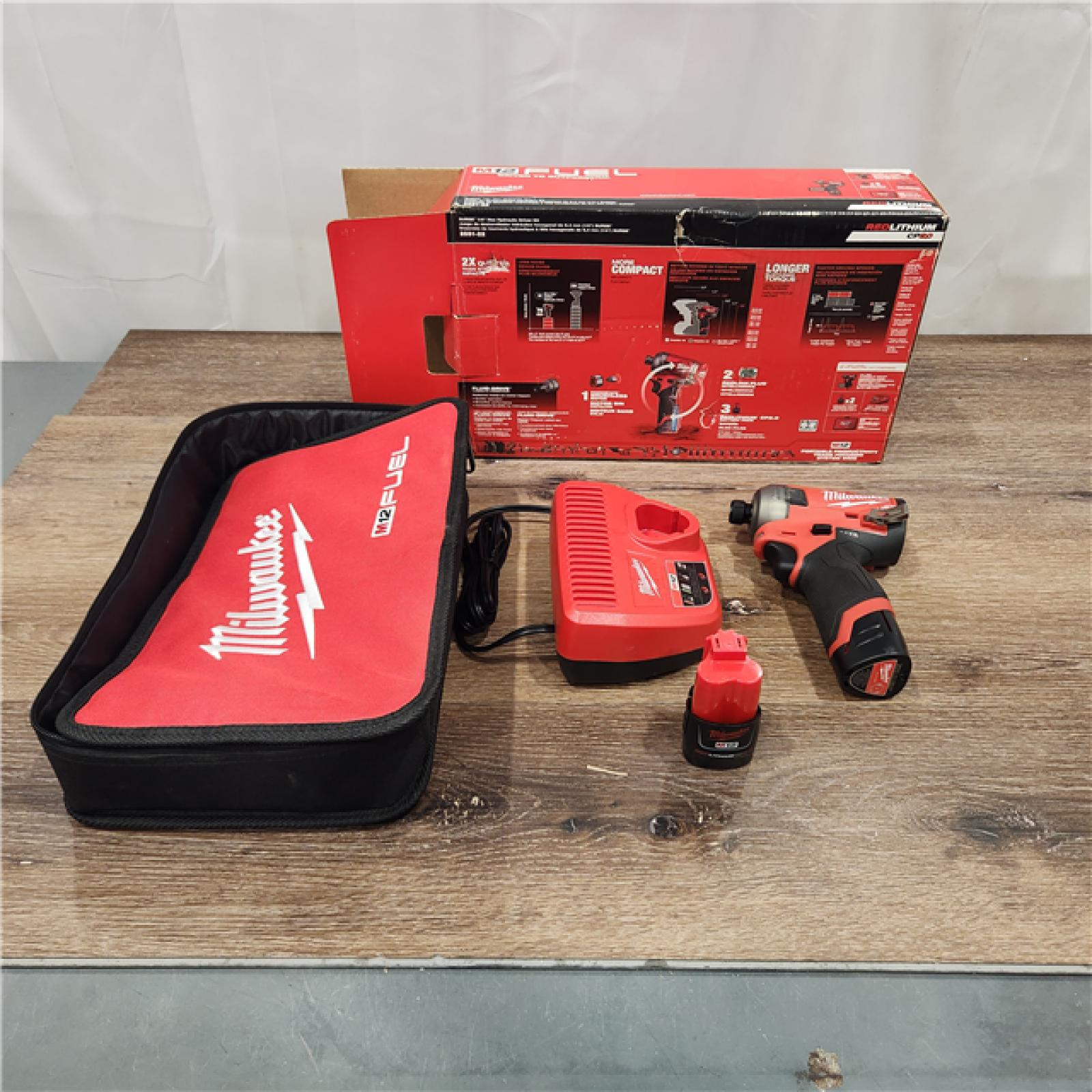 AS-IS Milwaukee M12 1/4  12V Brushless Hex Impact Driver Kit 2551-22 with (2) 2Ah Batteries  Charger  & Tool Bag