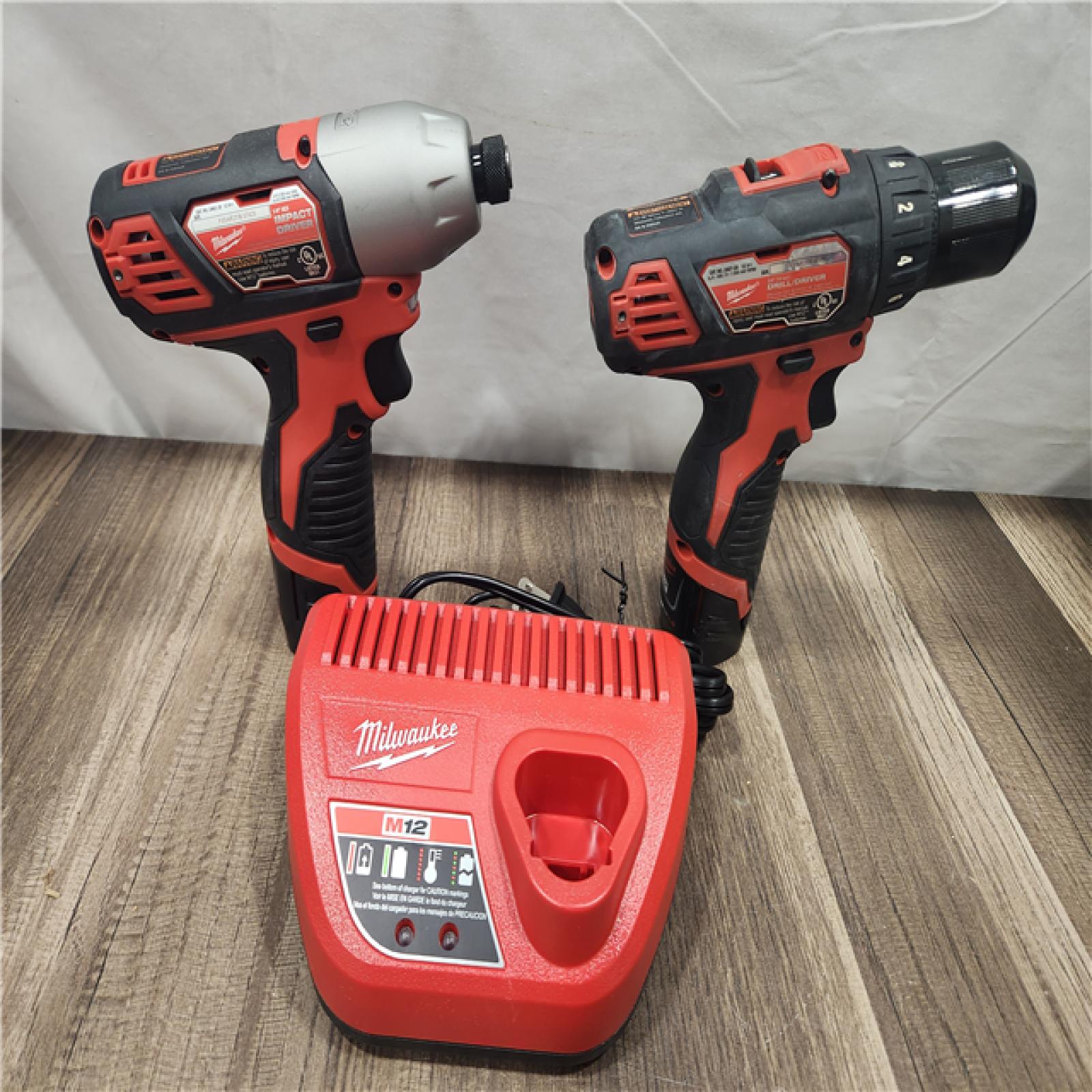 AS-IS- Milwaukee M12 Cordless Combination 3/8  Drill / Driver and 1/4  Hex Impact Driver Dual Power Tool Kit (2 Lithium Ion Batteries  Charger  and B