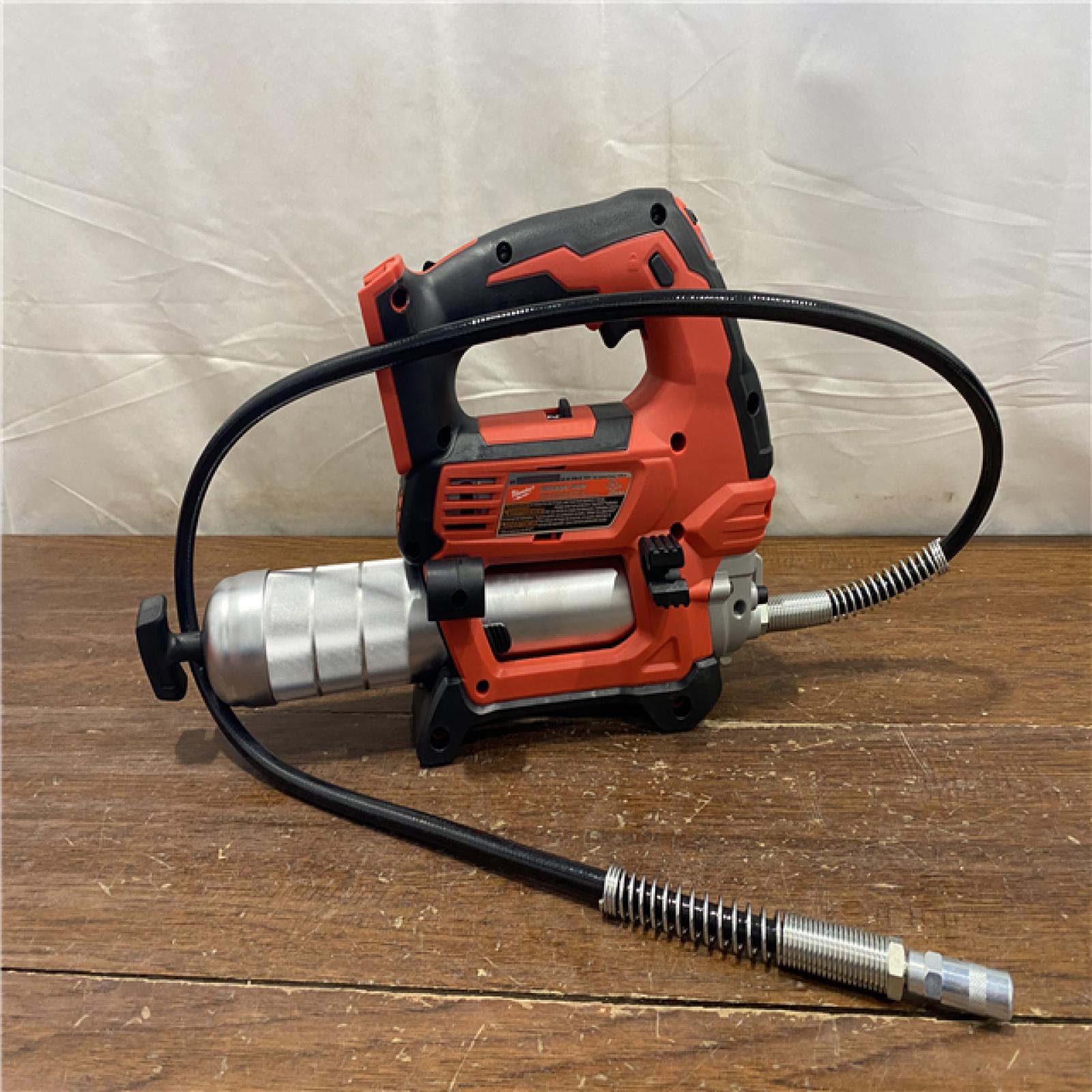AS-IS Milwaukee Tool 10,000 PSI 14 Oz Battery-Operated Grease Gun - 48 Flexible Hose, 31 Strokes/oz | Part #2646-20