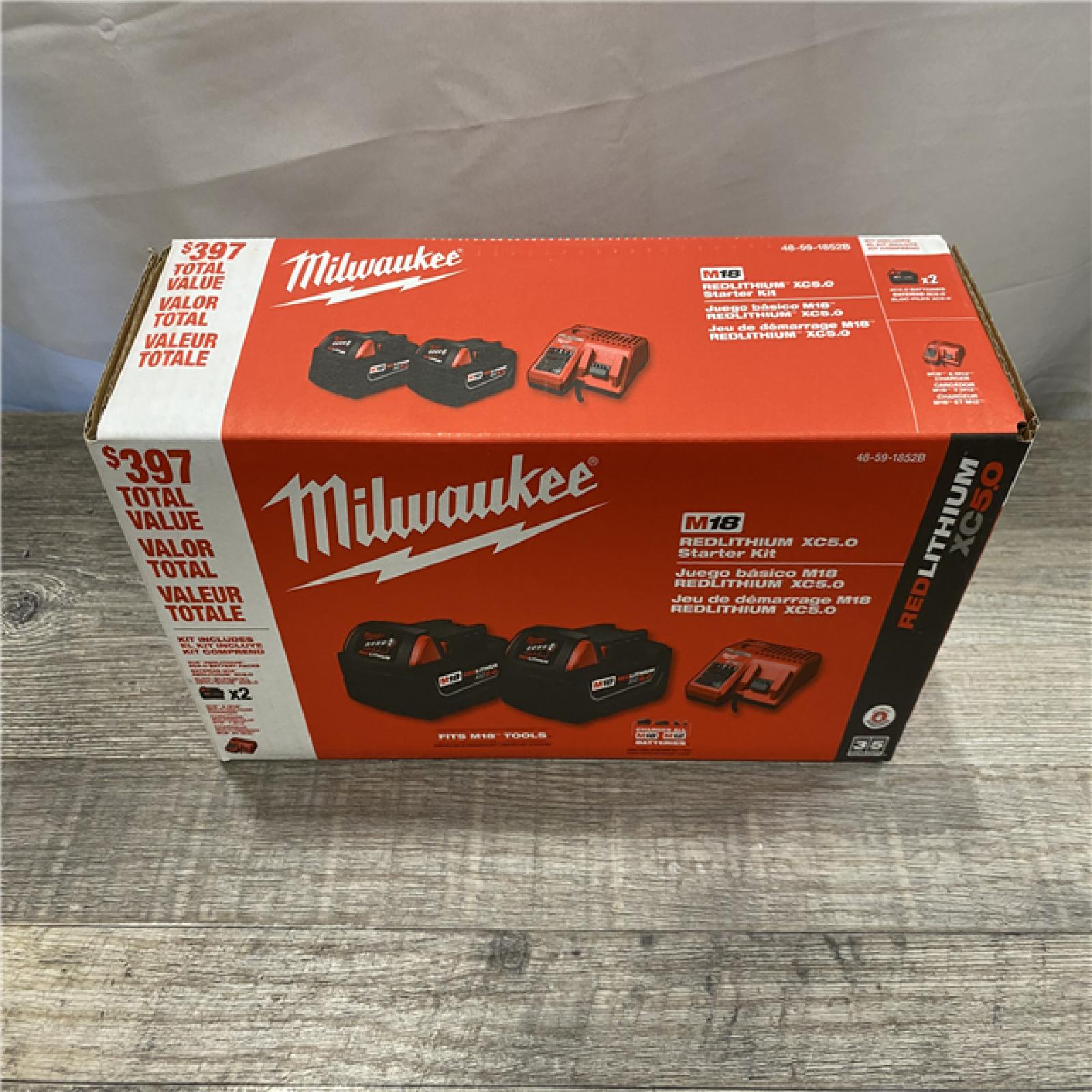 NEW - Milwaukee 18-Volt Lithium-Ion XC Starter Kit with Two 5.0Ah Batteries and Charger