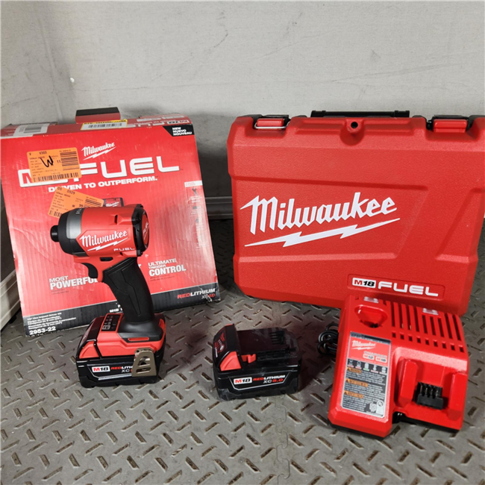 Houston location- AS-IS Milwaukee M18 FUEL 1/4 Hex Impact Driver Kit Appears in new condition