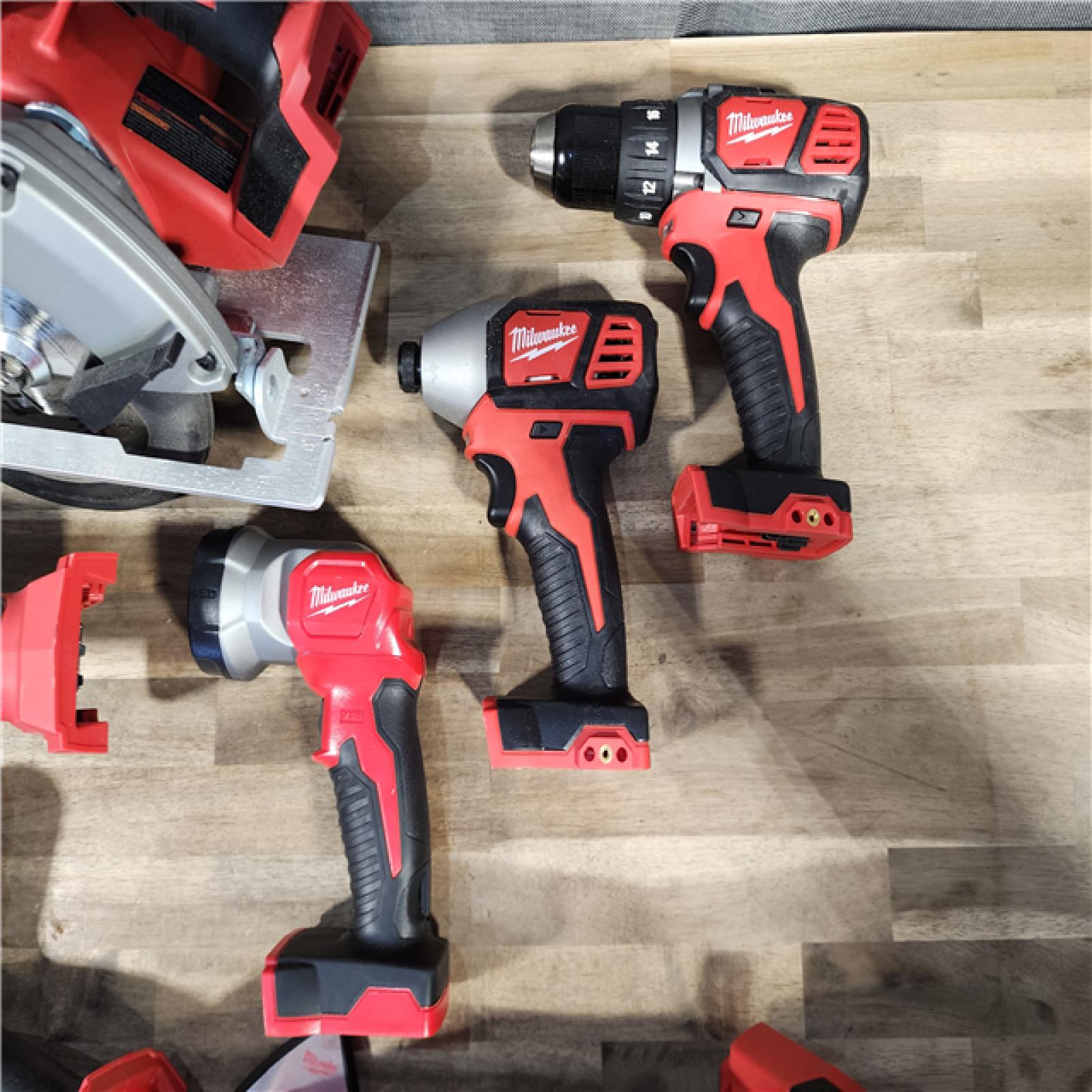 HOUSTON LOCATION - AS-IS MILWAUKEE 7 TOOL COMBO KIT W/ (2) 3.0 AH BATTERY, CARRYING BAG & CHARGER