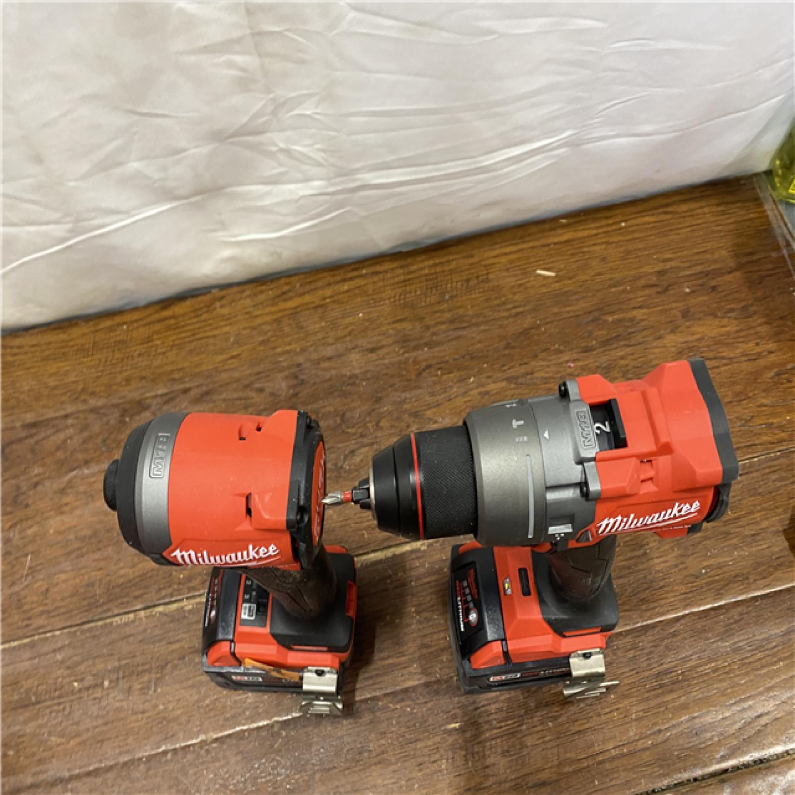 AS-IS MILWAUKEE M18 FUEL 18V Lithium-Ion Brushless Cordless Hammer Drill and Impact Driver Combo Kit (2-Tool) with 2 Batteries