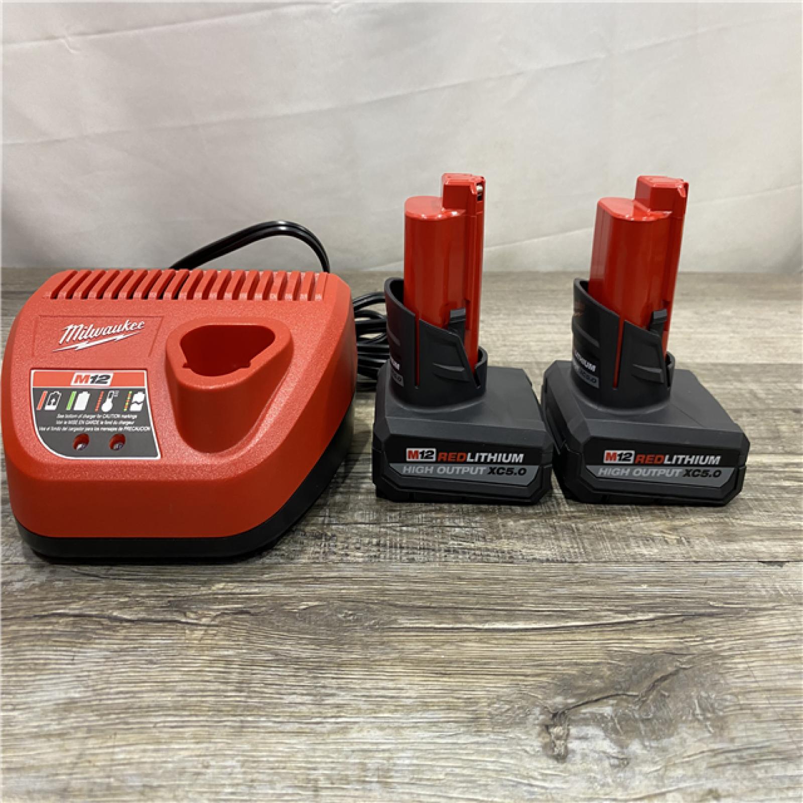 AS-IS Milwaukee 12V Lithium-Ion XC High Output 5.0 Ah Battery Pack (2-Pack) Starter Kit with Charger