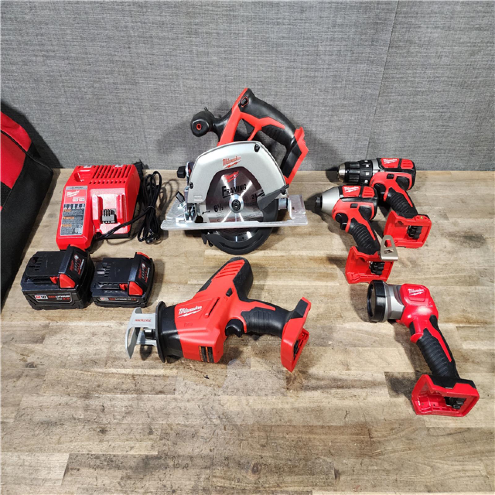 HOUSTON LOCATION - AS-IS M18 18V Lithium-Ion Cordless Combo Kit (5-Tool) with (1) 3.0Ah and (1) 1.5Ah Battery, (1) Charger, (1) Tool Bag