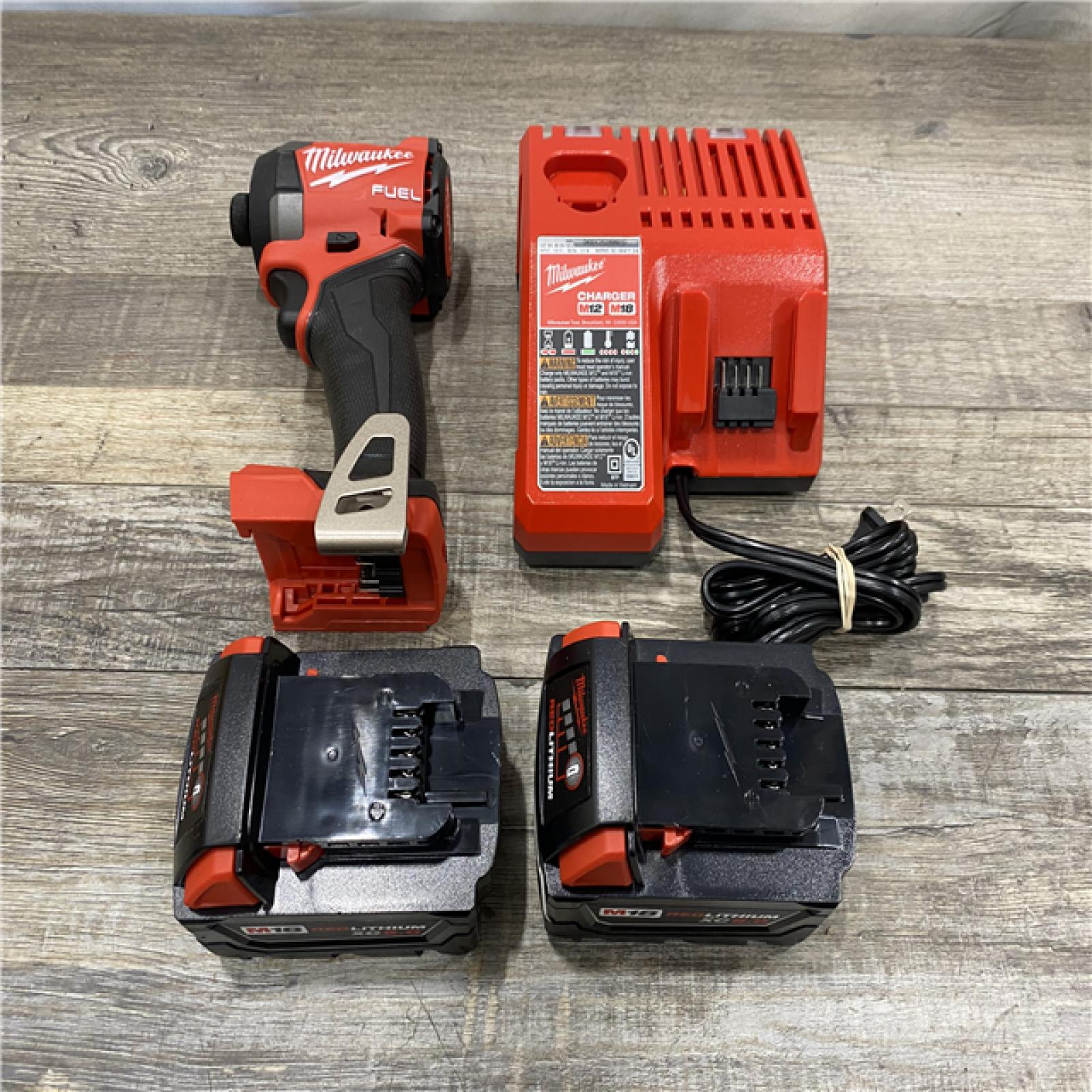 AS-IS Milwaukee FUEL 18V Lithium-Ion Brushless Cordless 1/4 in. Hex Impact Driver Kit