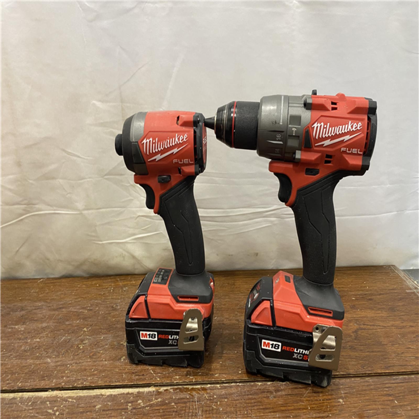 AS-IS MILWAUKEE M18 FUEL 18V Lithium-Ion Brushless Cordless Hammer Drill and Impact Driver Combo Kit (2-Tool) with 2 Batteries
