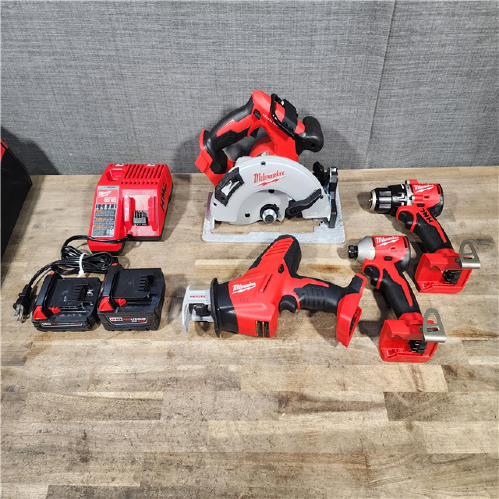 HOUSTON LOCATION - AS-IS Milwaukee M18 18-Volt Lithium-Ion Brushless Cordless Combo Kit (4-Tool) with 2-Batteries  1-Charger and Tool Bag