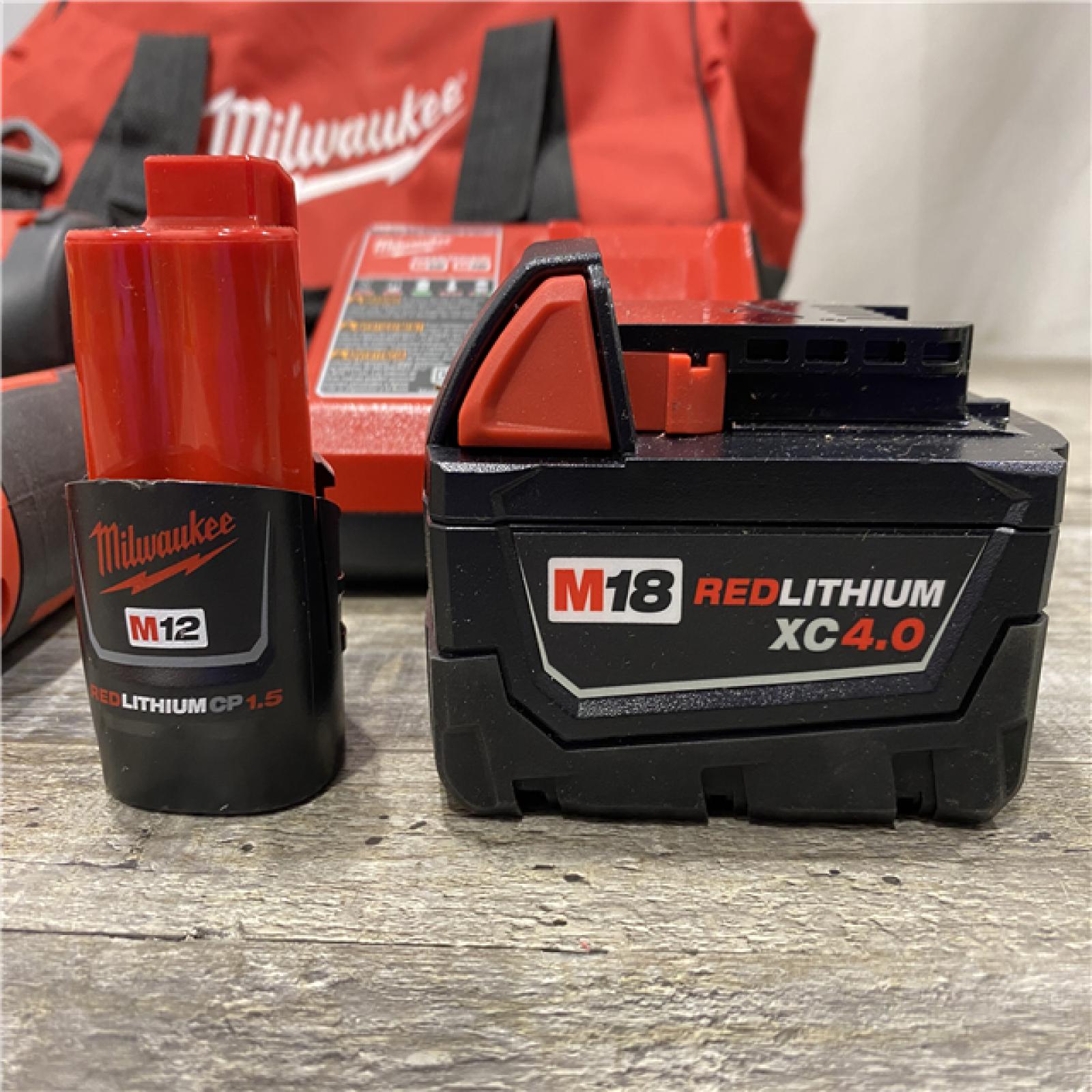 AS-IS Milwaukee 12/18V Lithium-Ion Cordless 3/8 in. Ratchet and 1/2 in. High Torque Impact Wrench with Friction Ring Combo Kit
