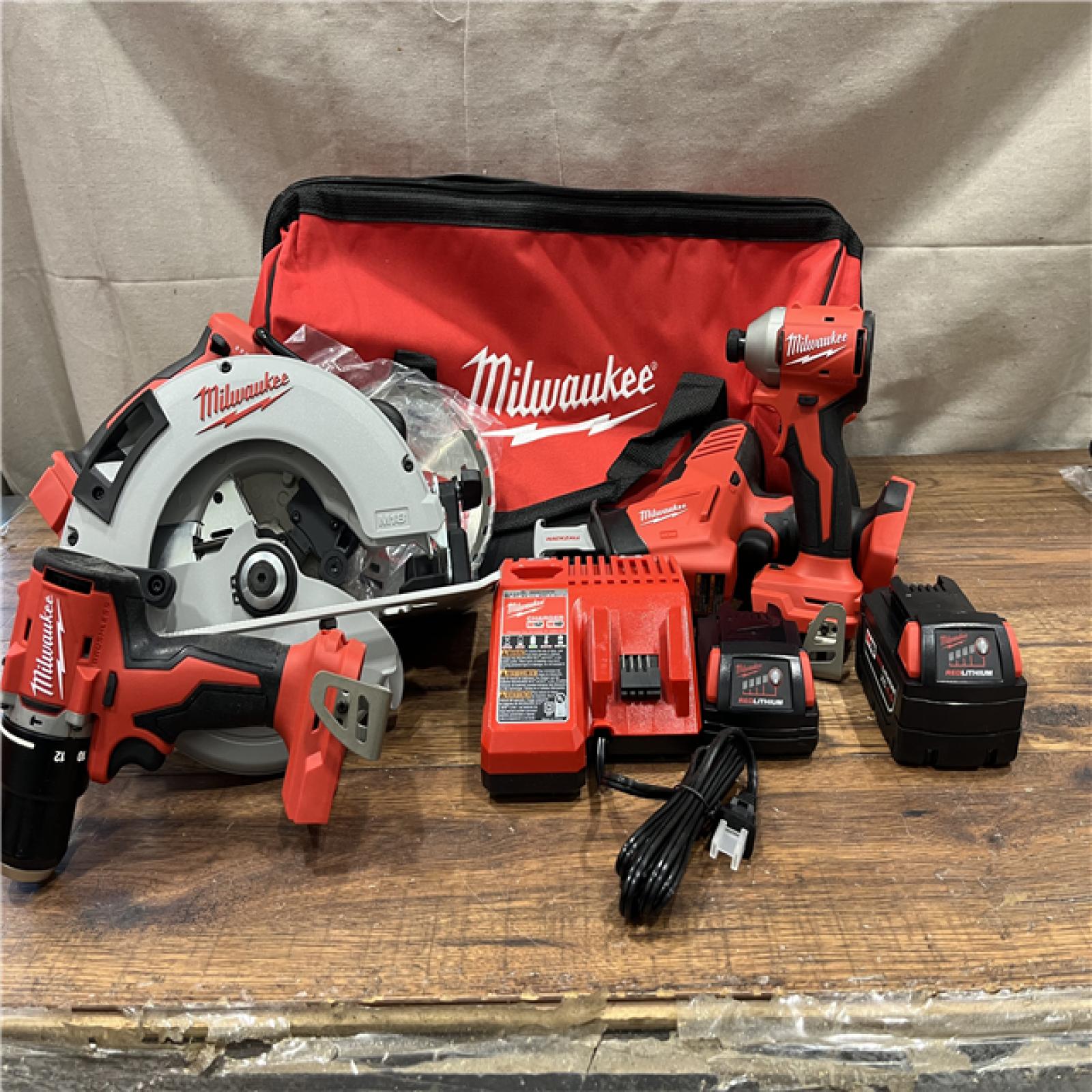 AS-IS Milwaukee M18 18-Volt Lithium-Ion Brushless Cordless Combo Kit (4-Tool) with 2-Batteries, 1-Charger and Tool Bag
