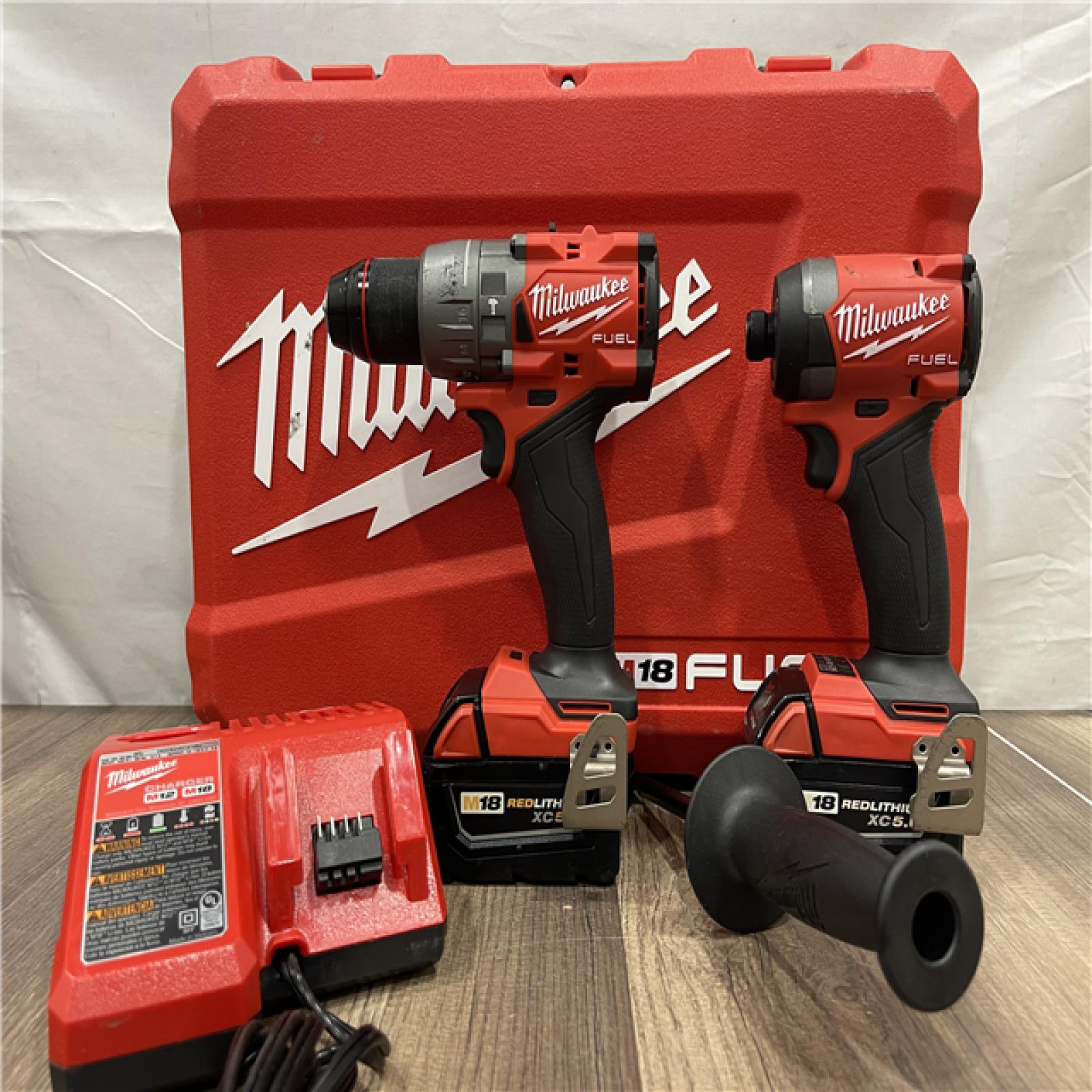 AS-IS Milwaukee FUEL 18V Lithium-Ion Brushless Cordless Hammer Drill and Impact Driver Combo Kit