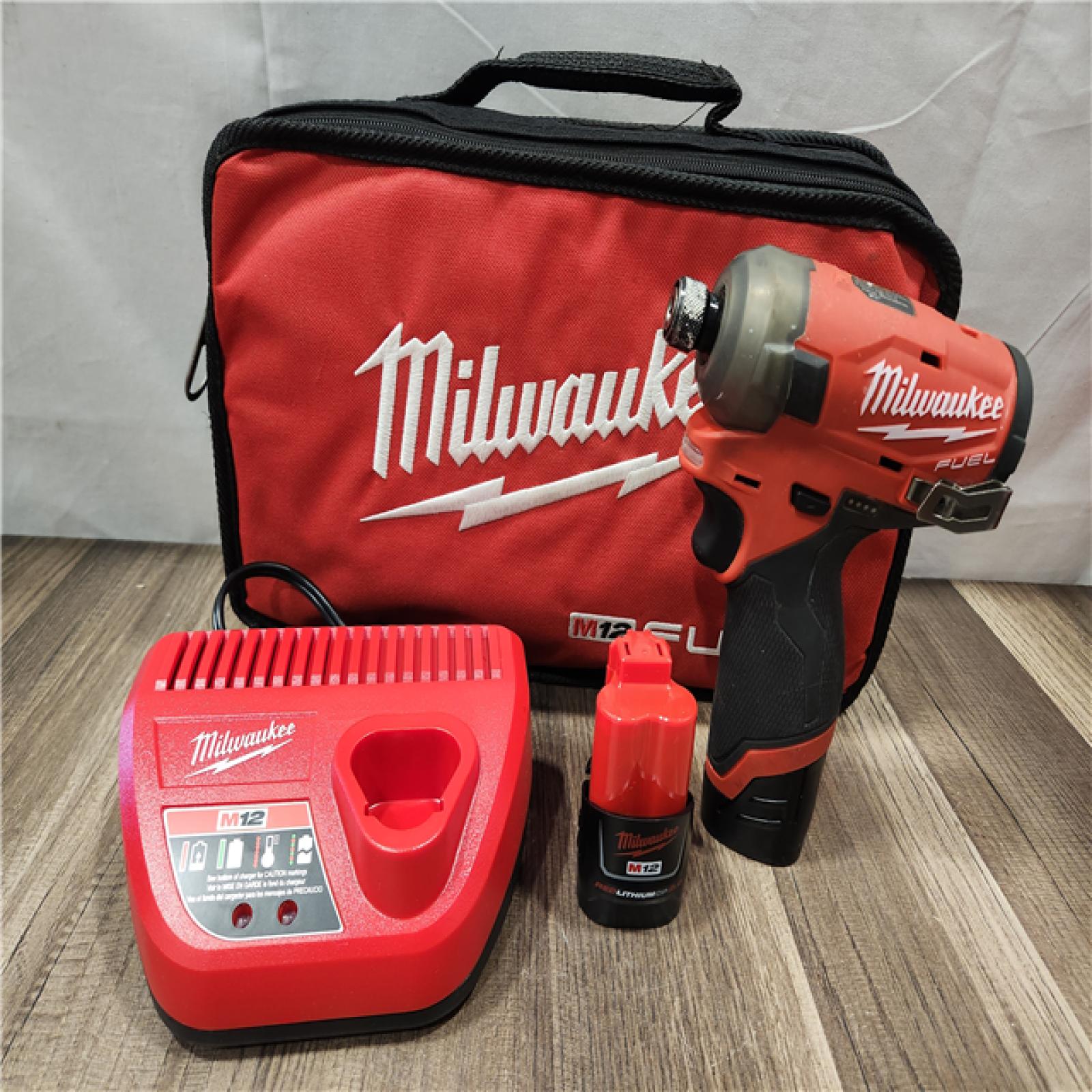 AS-IS- Milwaukee M12 FUEL SURGE 12V Lithium-Ion Brushless Cordless 1/4 in. Hex Impact Driver Compact Kit W/Two 2.0Ah Batteries  Bag