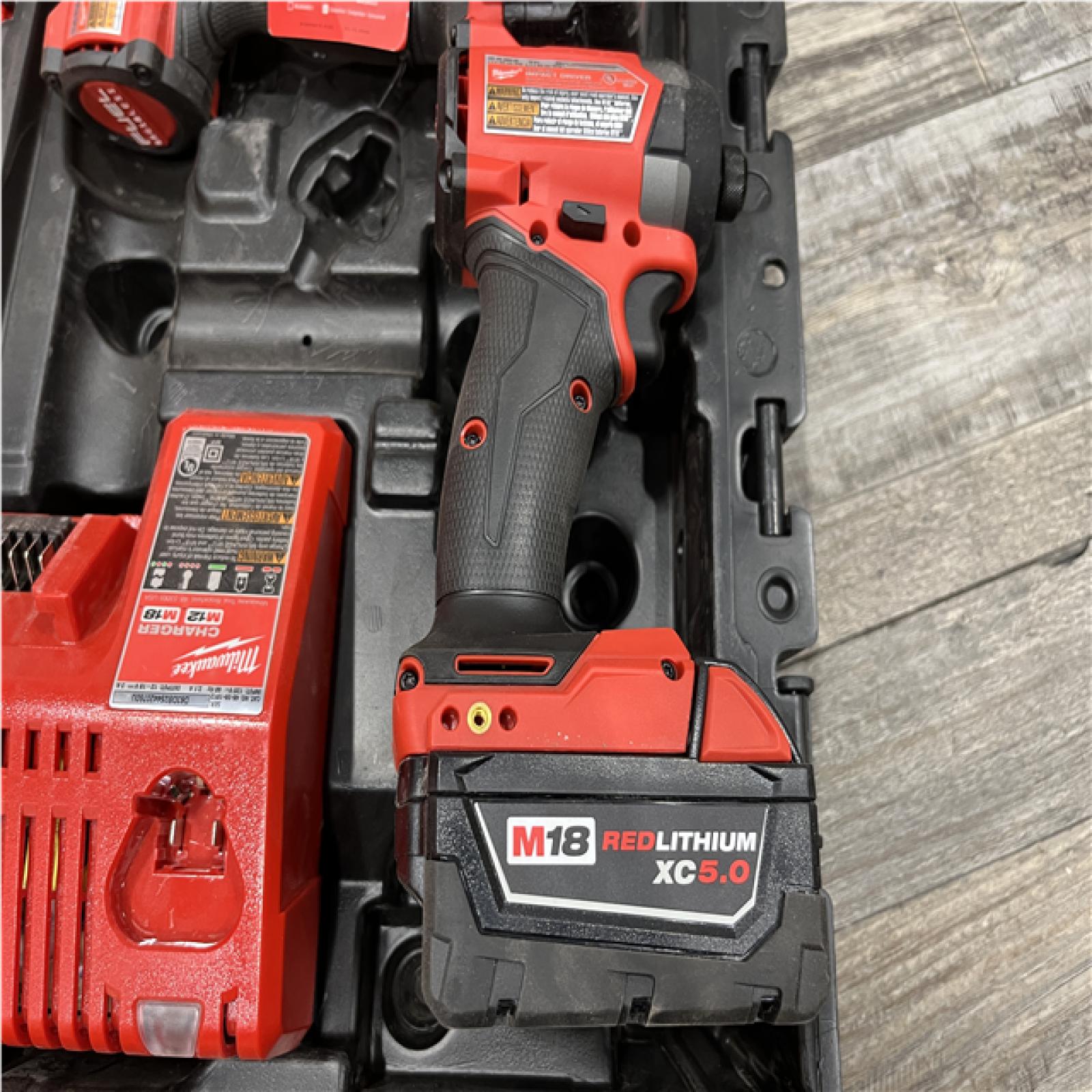 AS-IS Milwaukee FUEL 18V Lithium-Ion Brushless Cordless Hammer Drill and Impact Driver Combo Kit