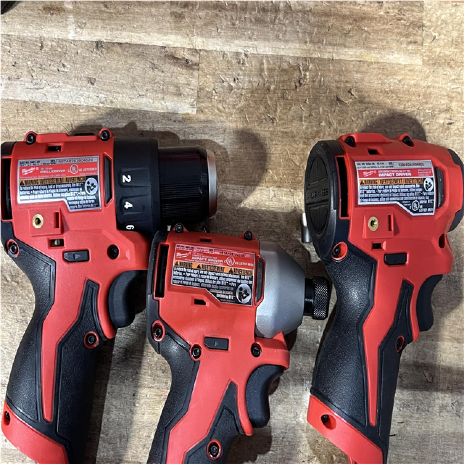 Houston Location AS-IS Milwaukee Drill Driver and Impact Drivers QTY/2 and Batteries with Charger