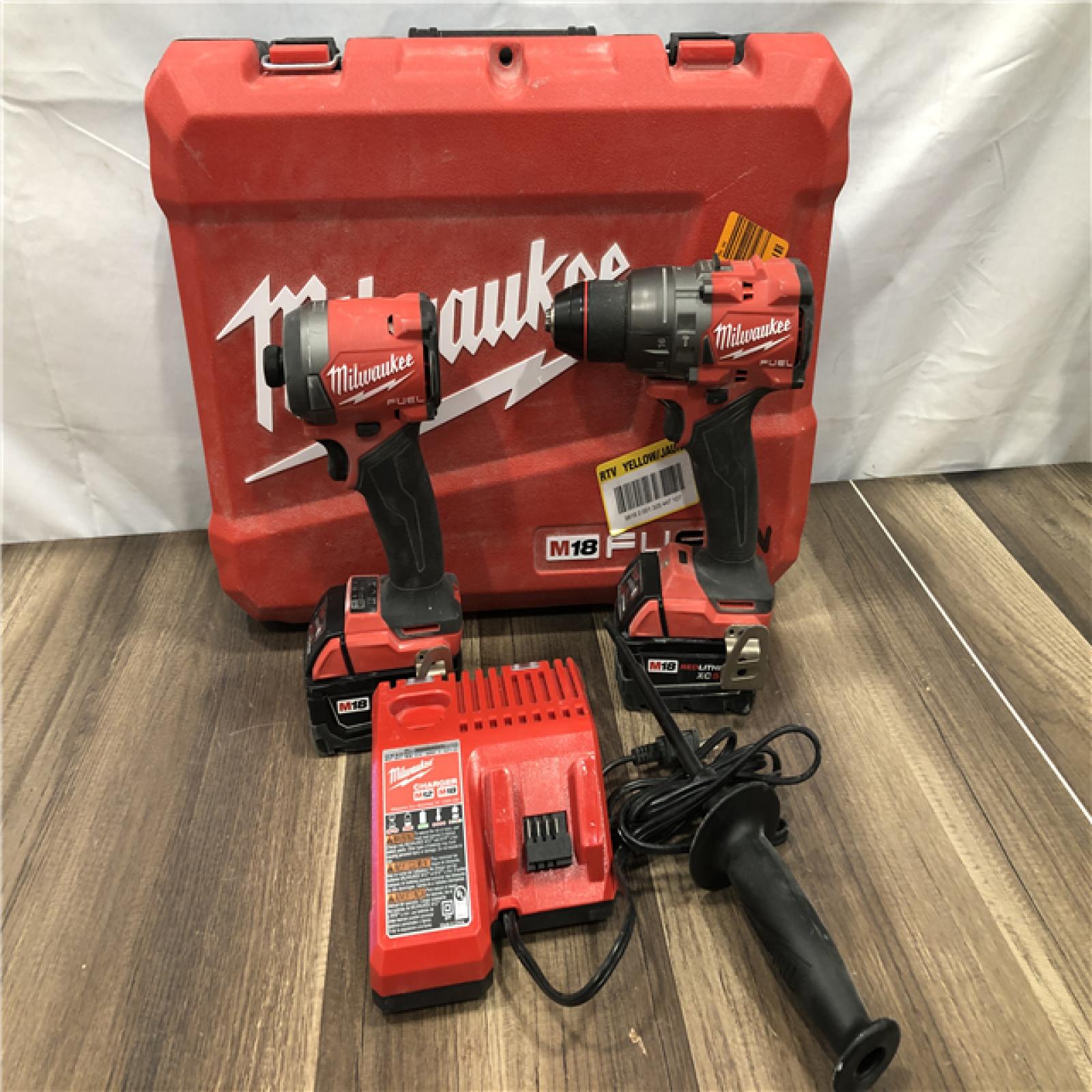 AS-IS Milwaukee FUEL 18V Lithium-Ion Brushless Cordless Hammer Drill and Impact Driver Combo Kit