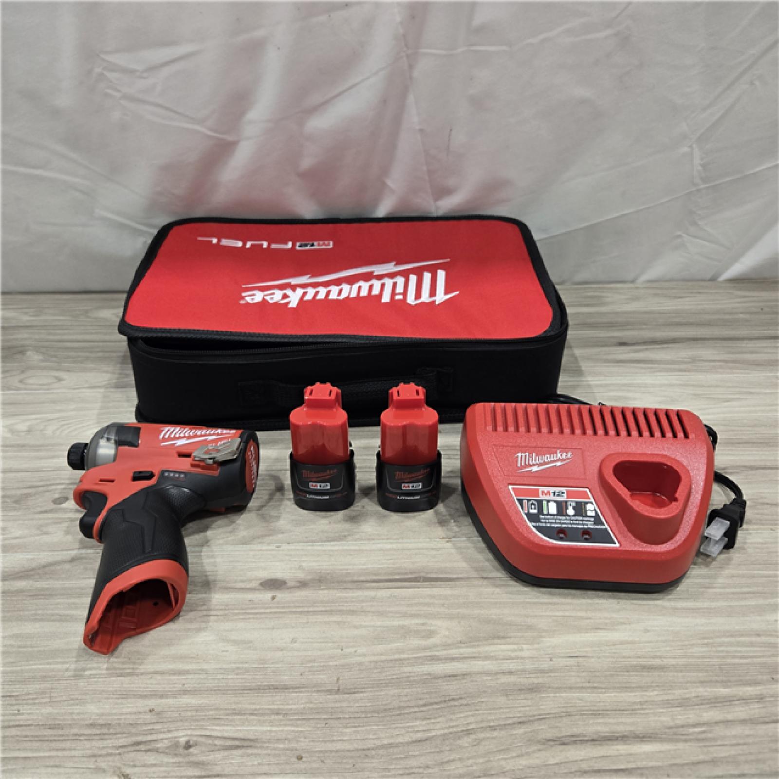AS-IS Milwaukee M12 FUEL SURGE 12V Cordless 1/4 in. Hex Impact Driver Compact Kit